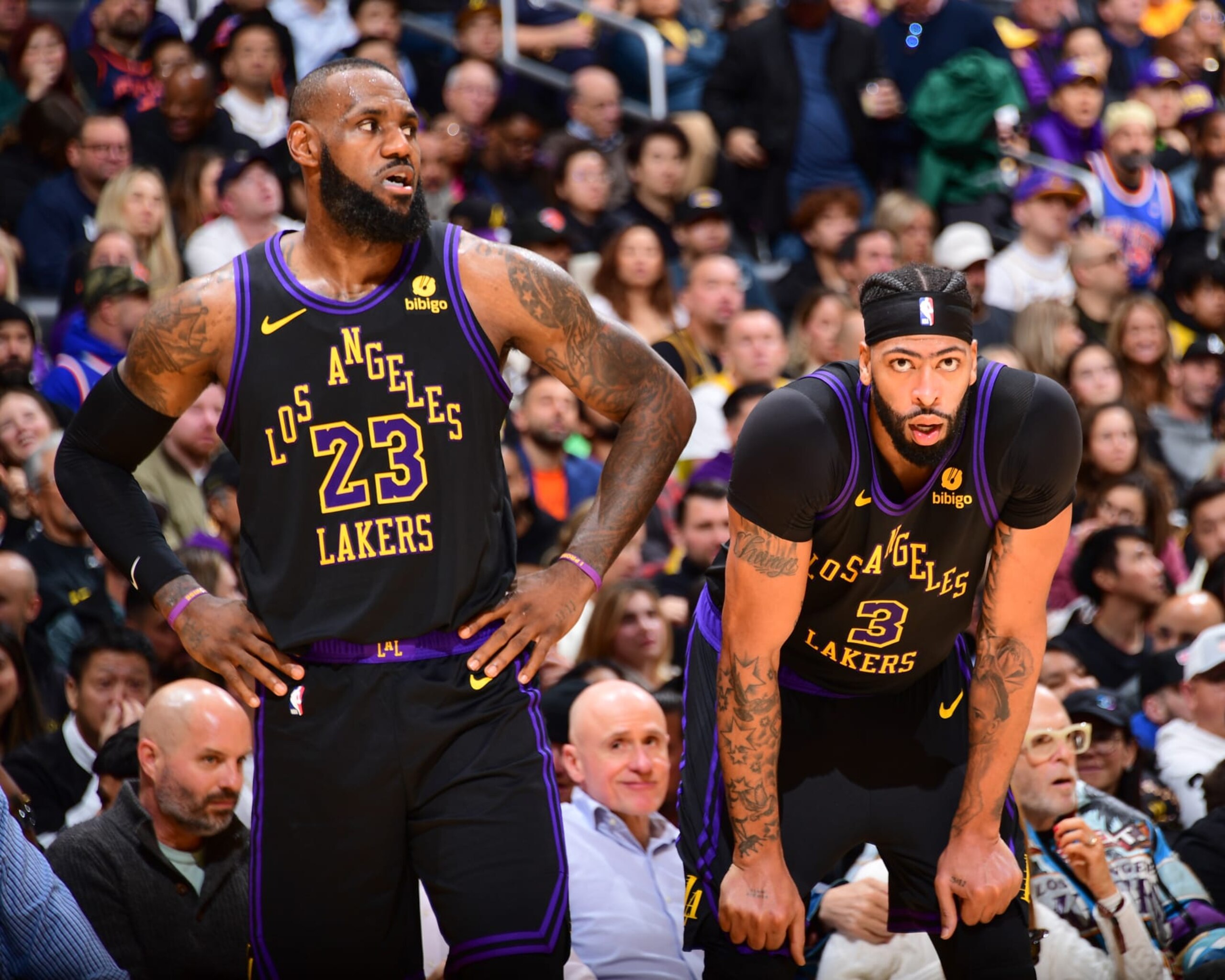 LOS ANGELES, CA - DECEMBER 18:  LeBron James #23 of the Los Angeles Lakers & Anthony Davis #3 of the Los Angeles Lakers looks on during the game on December 18, 2023 at Crypto.Com Arena in Los Angeles, California. NOTE TO USER: User expressly acknowledges and agrees that, by downloading and/or using this Photograph, user is consenting to the terms and conditions of the Getty Images License Agreement. Mandatory Copyright Notice: Copyright 2023 NBAE (Photo by Adam Pantozzi/NBAE via Getty Images)