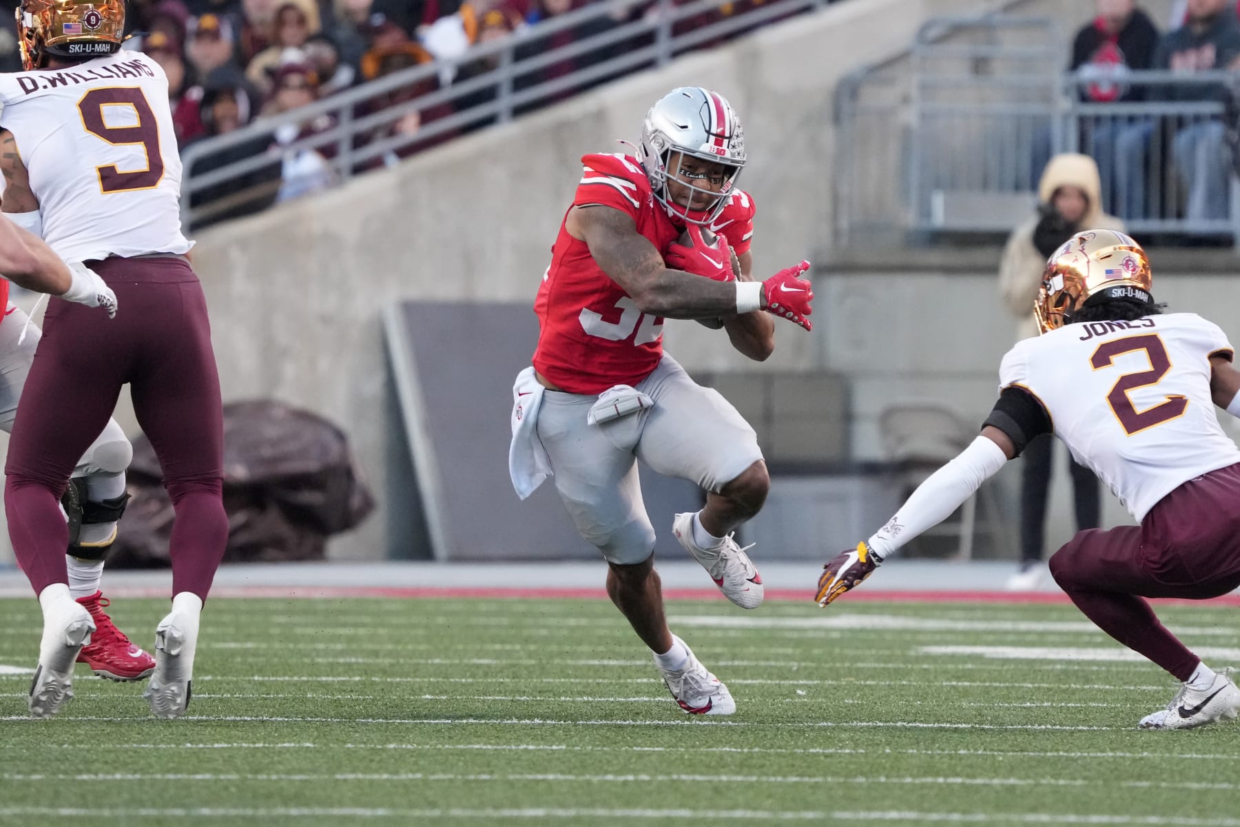 COLUMBUS, OHIO - NOVEMBER 18: Running back TreVeyon Henderson #32 of the Ohio State Buckeyes carries the ball during the second quarter against the Minnesota Golden Gophers at Ohio Stadium on November 18, 2023 in Columbus, Ohio. (Photo by Jason Mowry/Getty Images)