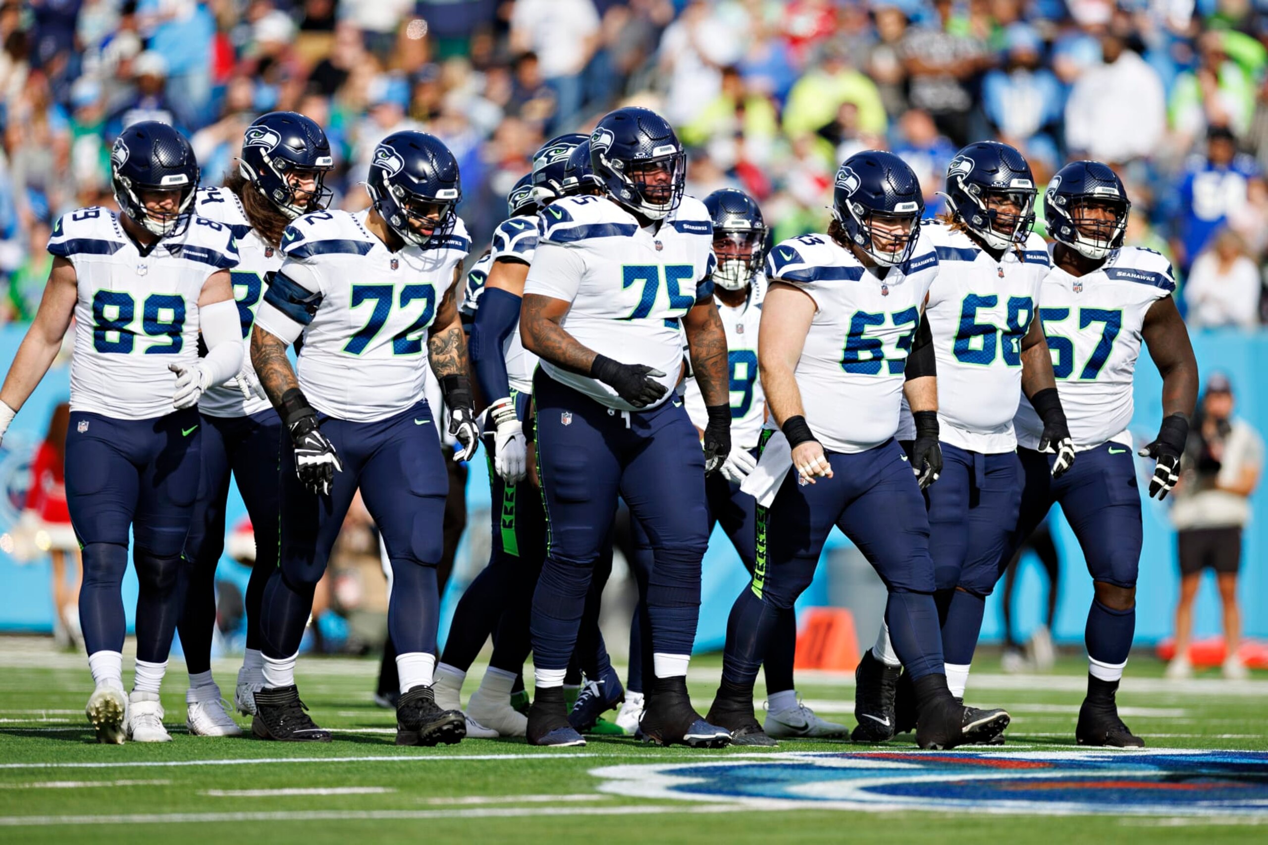 NASHVILLE, TENNESSEE - DECEMBER 24: Offensive line of the Seattle Seahawks breaks the huddle during the game against the Tennessee Titans at Nissan Stadium on December 24, 2023 in Nashville, Tennessee. The Seahawks defeated the Titans 20-17.  (Photo by Wesley Hitt/Getty Images)