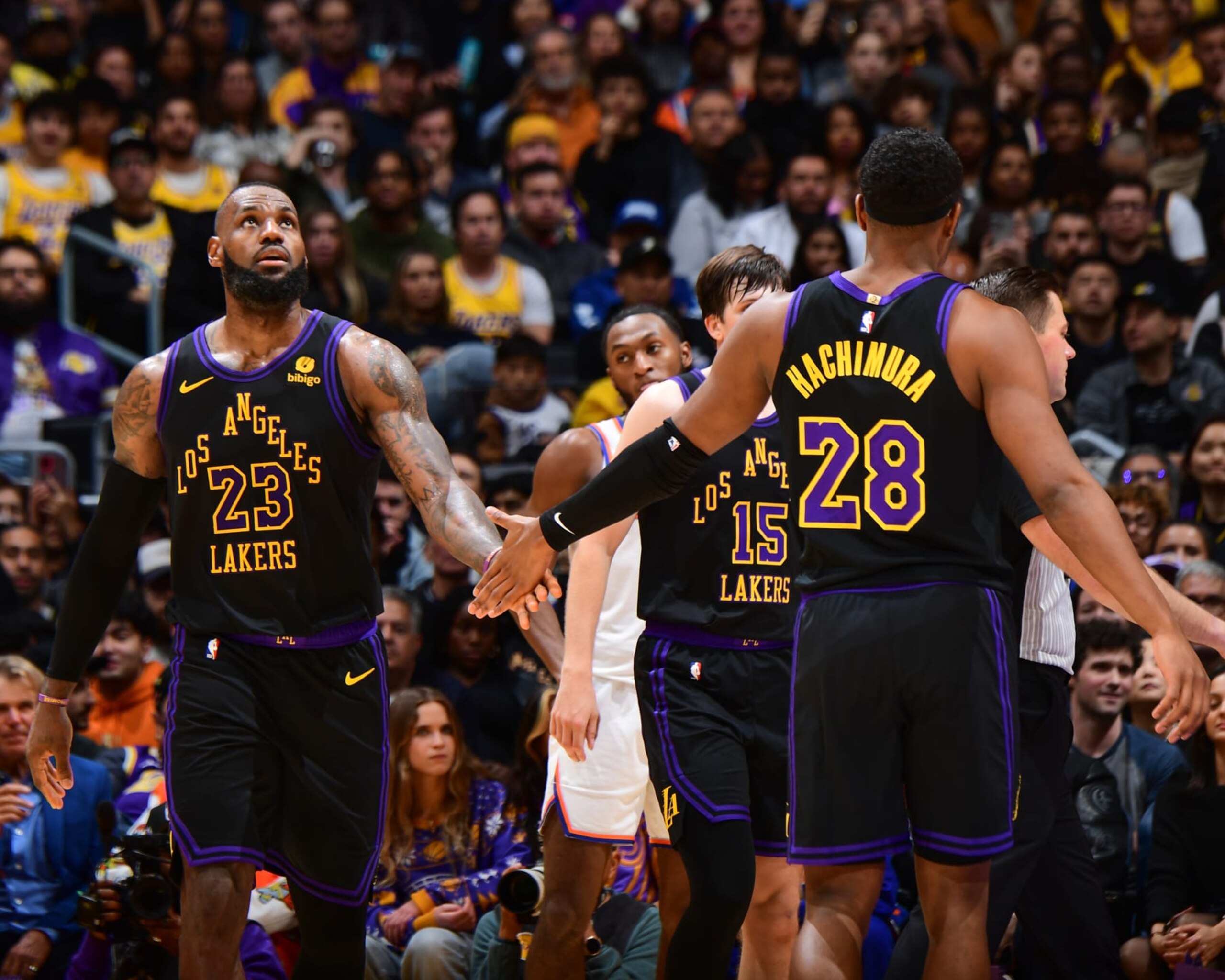 LOS ANGELES, CA - DECEMBER 18:  LeBron James #23 of the Los Angeles Lakers & Rui Hachimura #28 of the Los Angeles Lakers high five during the game  on December 18, 2023 at Crypto.Com Arena in Los Angeles, California. NOTE TO USER: User expressly acknowledges and agrees that, by downloading and/or using this Photograph, user is consenting to the terms and conditions of the Getty Images License Agreement. Mandatory Copyright Notice: Copyright 2023 NBAE (Photo by Adam Pantozzi/NBAE via Getty Images)