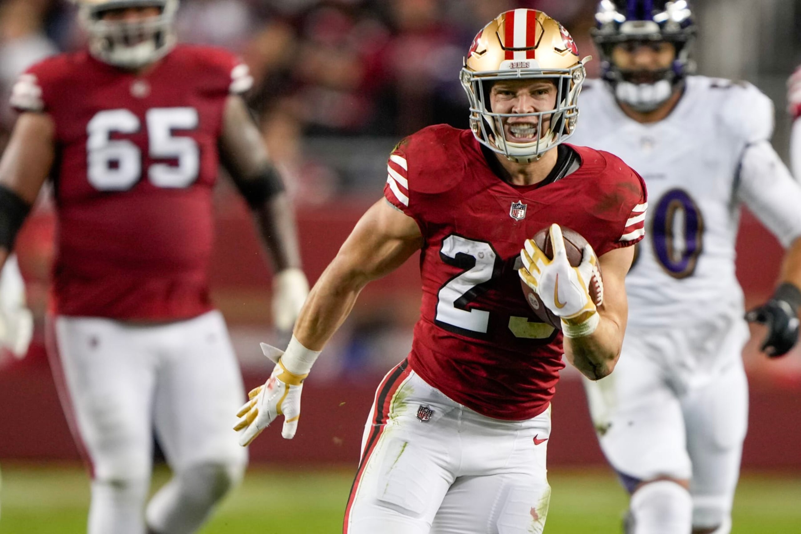 SANTA CLARA, CALIFORNIA - DECEMBER 25: Christian McCaffrey #23 of the San Francisco 49ers runs the ball during the second quarter against the Baltimore Ravens at Levi's Stadium on December 25, 2023 in Santa Clara, California. (Photo by Thearon W. Henderson/Getty Images)