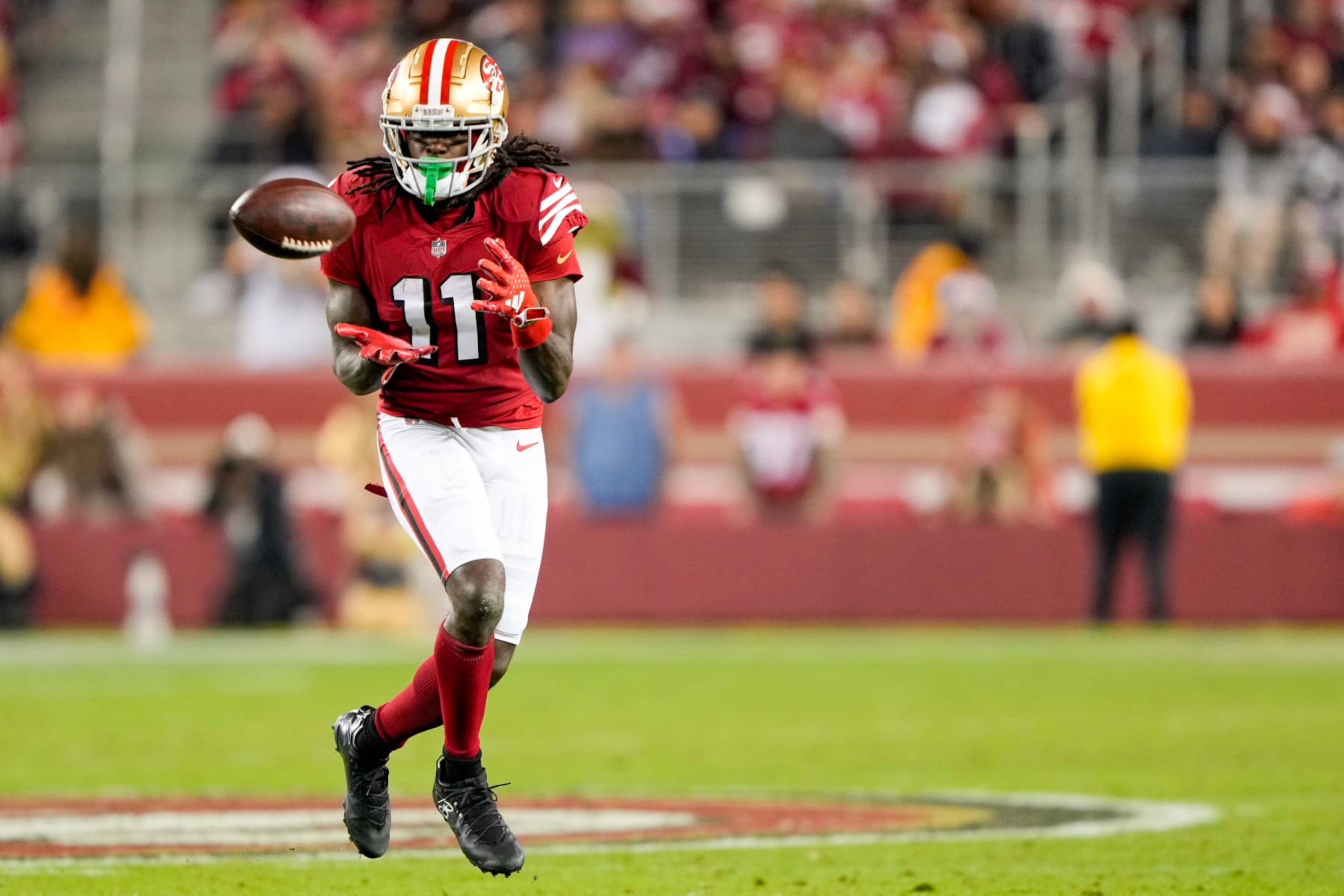 SANTA CLARA, CALIFORNIA - DECEMBER 25: Brandon Aiyuk #11 of the San Francisco 49ers catches a pass during the fourth quarter against the Baltimore Ravens at Levi's Stadium on December 25, 2023 in Santa Clara, California. (Photo by Thearon W. Henderson/Getty Images)