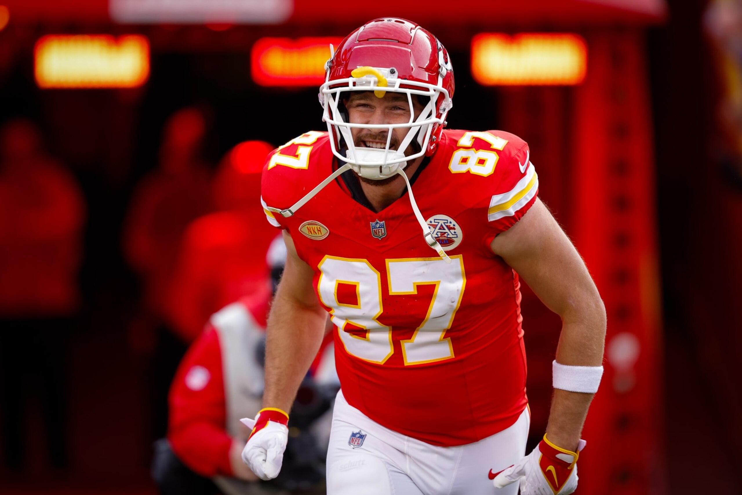 KANSAS CITY, MISSOURI - DECEMBER 10: Travis Kelce #87 of the Kansas City Chiefs runs onto the field during introductions prior to the game against the Buffalo Bills at GEHA Field at Arrowhead Stadium on December 10, 2023 in Kansas City, Missouri. (Photo by David Eulitt/Getty Images)
