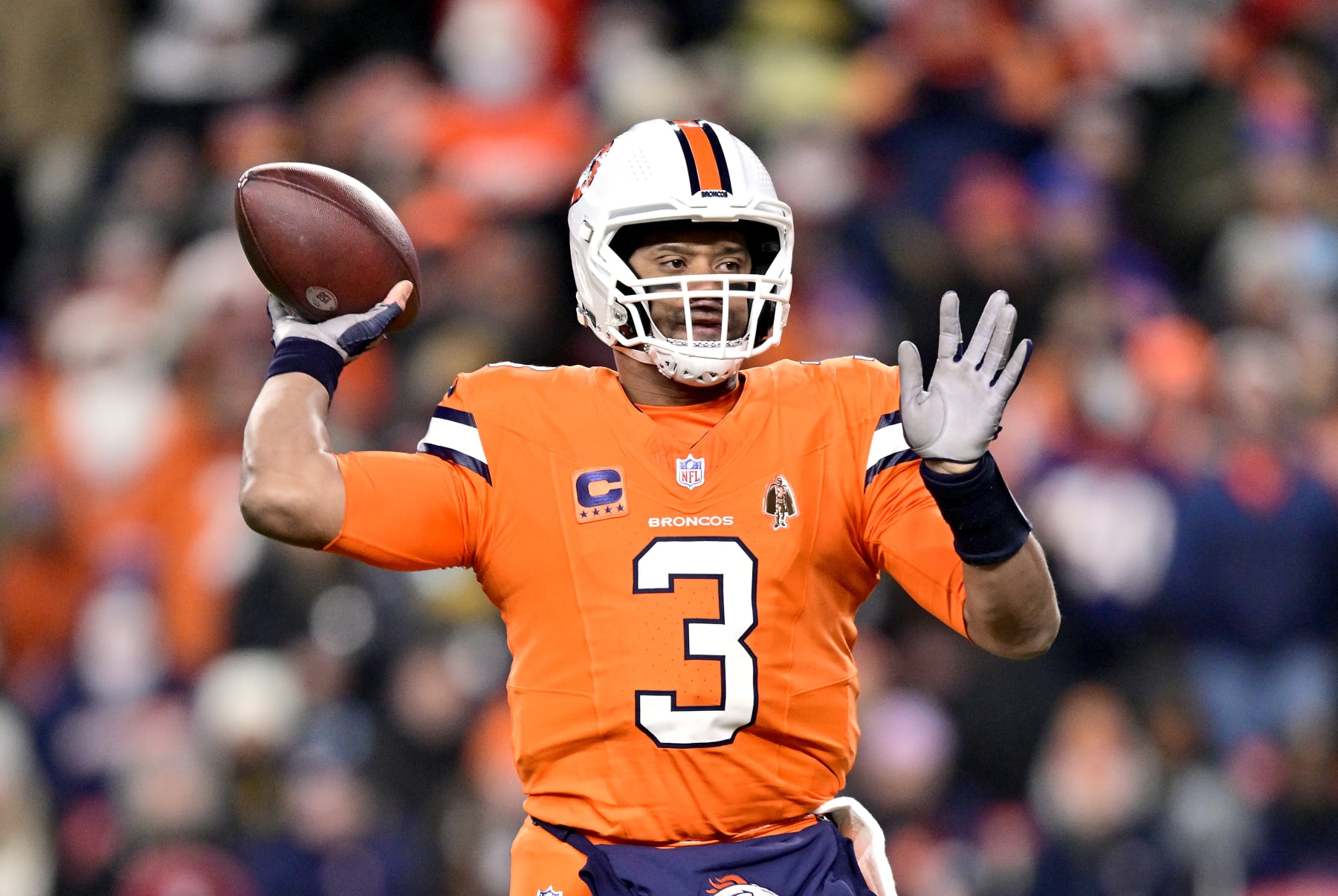 DENVER, COLORADO - DECEMBER 24:  Quarterback Russell Wilson #3 of the Denver Broncos passes during the 1st quarter of the game against the New England Patriots at Empower Field At Mile High on December 24, 2023 in Denver, Colorado. (Photo by Dustin Bradford/Getty Images)