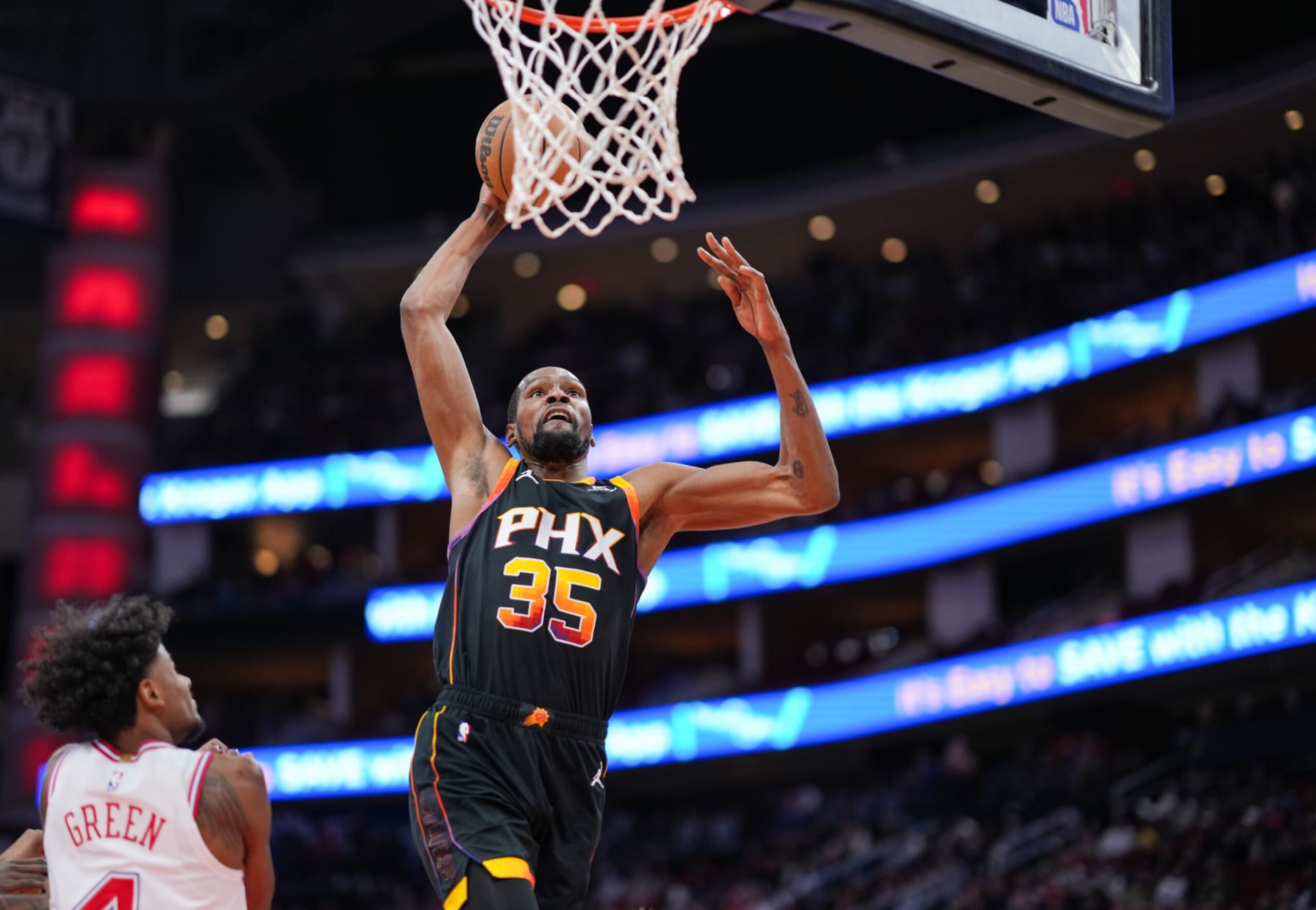 HOUSTON, TEXAS - DECEMBER 27: Kevin Durant #35 of the Phoenix Suns goes up for a dunk during the second quarter of the game against the Houston Rockets at Toyota Center on December 27, 2023 in Houston, Texas. User expressly acknowledges and agrees that, by downloading and or using this photograph, User is consenting to the terms and conditions of the Getty Images License Agreement. (Photo by Alex Bierens de Haan/Getty Images)