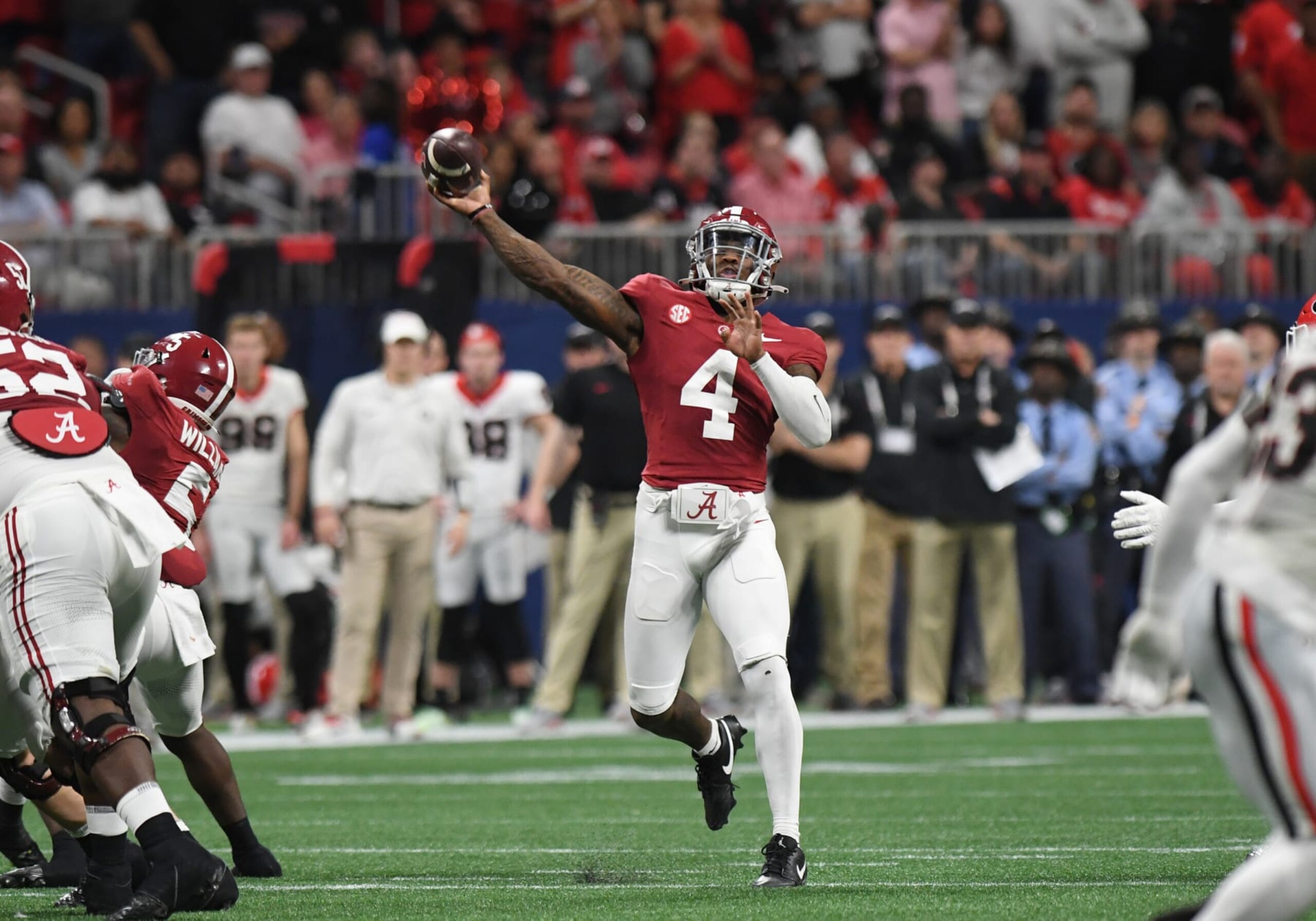 ATLANTA, GA - DECEMBER 02: Alabama Crimson Tide Quarterback Jalen Milroe (4) passes the ball during the SEC Championship Game between the Georgia Bulldogs and the Alabama Crimson Tide on December 02, 2023, at Mercedes-Benz Stadium in Atlanta, GA. (Photo by Jeffrey Vest/Icon Sportswire via Getty Images)