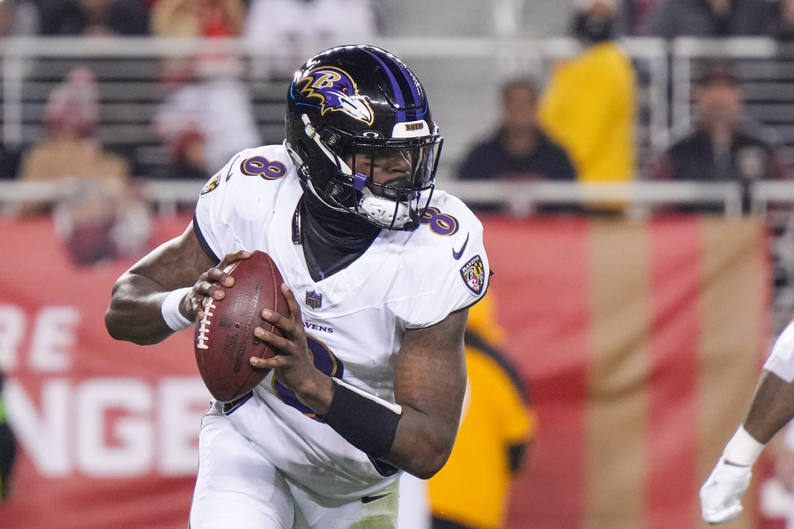 SANTA CLARA, CALIFORNIA - DECEMBER 25: Lamar Jackson #8 of the Baltimore Ravens looks to pass against the San Francisco 49ers during the first half at Levi's Stadium on December 25, 2023 in Santa Clara, California. (Photo by Loren Elliott/Getty Images)