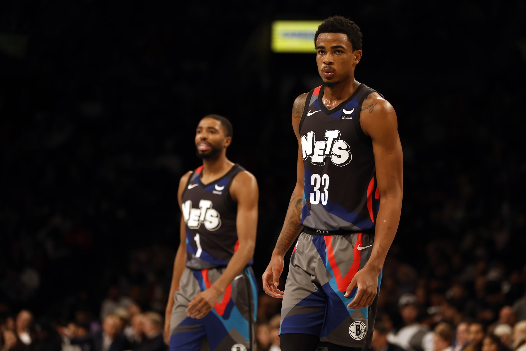 NEW YORK, NEW YORK - NOVEMBER 28: Nic Claxton #33 and Mikal Bridges #1 of the Brooklyn Nets look on during the second half of an NBA In-Season Tournament game against the Toronto Raptors at Barclays Center on November 28, 2023 in the Brooklyn borough of New York City. The Nets won 115-103. NOTE TO USER: User expressly acknowledges and agrees that, by downloading and/or using this photograph, User is consenting to the terms and conditions of the Getty Images License Agreement. (Photo by Sarah Stier/Getty Images)