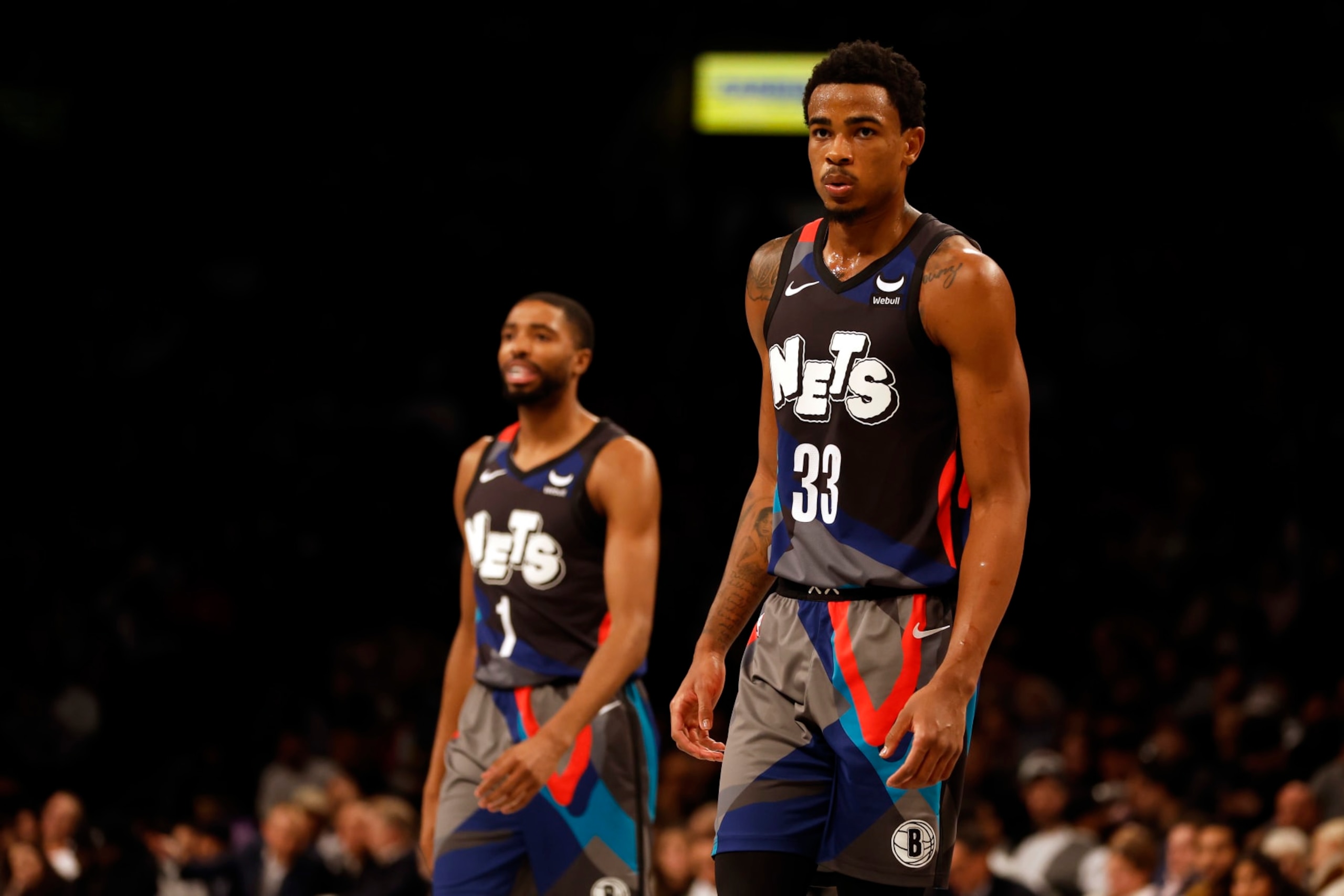 NEW YORK, NEW YORK - NOVEMBER 28: Nic Claxton #33 and Mikal Bridges #1 of the Brooklyn Nets look on during the second half of an NBA In-Season Tournament game against the Toronto Raptors at Barclays Center on November 28, 2023 in the Brooklyn borough of New York City. The Nets won 115-103. NOTE TO USER: User expressly acknowledges and agrees that, by downloading and/or using this photograph, User is consenting to the terms and conditions of the Getty Images License Agreement. (Photo by Sarah Stier/Getty Images)