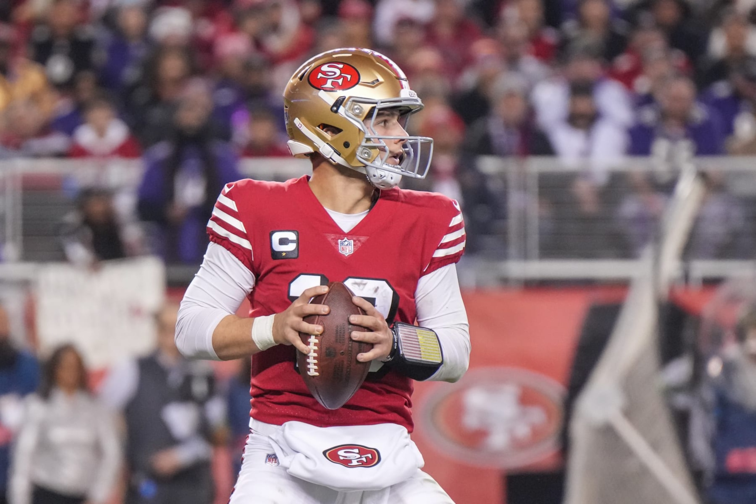 SANTA CLARA, CALIFORNIA - DECEMBER 25: Brock Purdy #13 of the San Francisco 49ers looks to pass during the second half against the Baltimore Ravens at Levi's Stadium on December 25, 2023 in Santa Clara, California. (Photo by Loren Elliott/Getty Images)