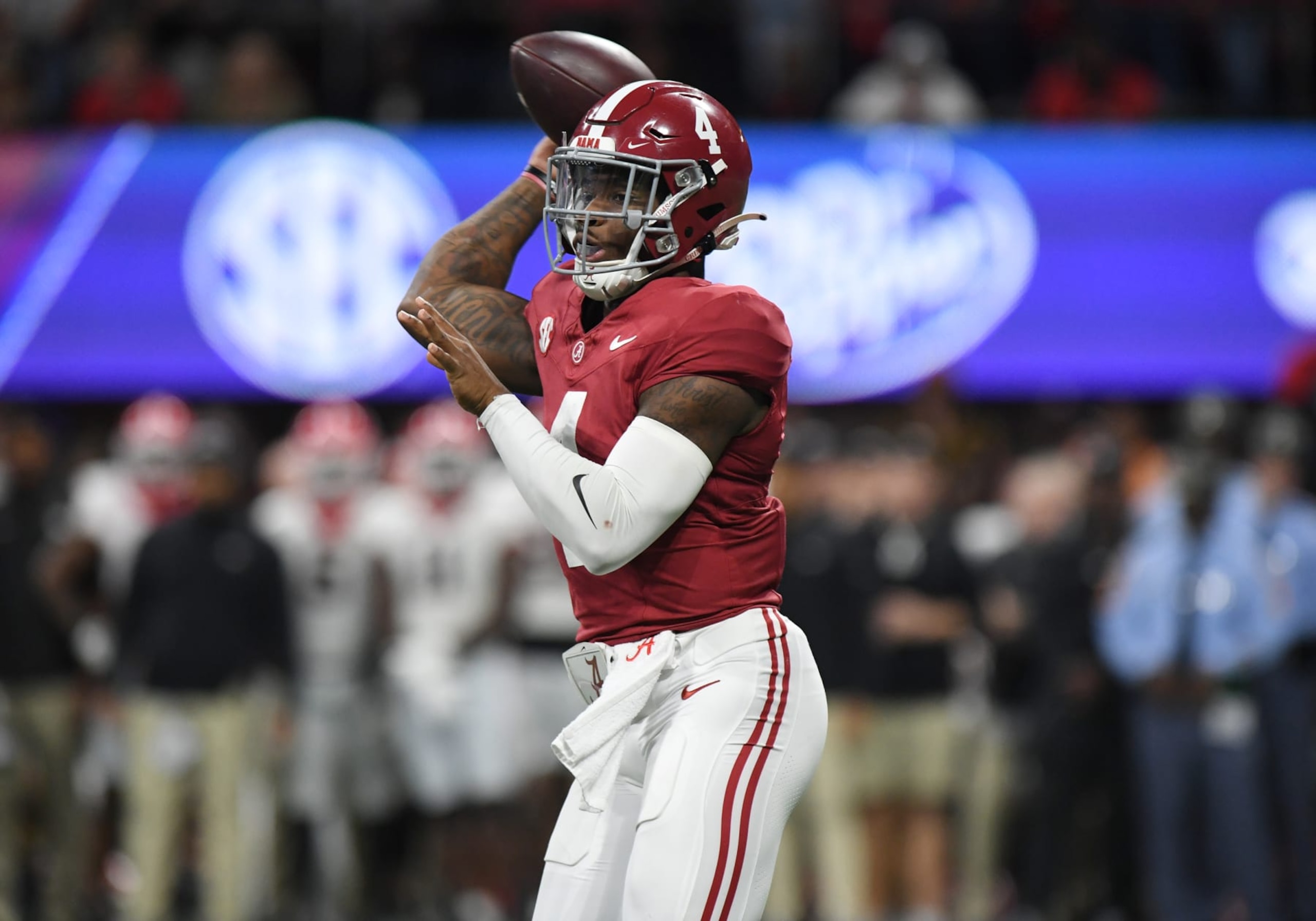ATLANTA, GA - DECEMBER 02: Alabama Crimson Tide Quarterback Jalen Milroe (4) passes the ball during the SEC Championship Game between the Georgia Bulldogs and the Alabama Crimson Tide on December 02, 2023, at Mercedes-Benz Stadium in Atlanta, GA. (Photo by Jeffrey Vest/Icon Sportswire via Getty Images) ATLANTA, GA - DECEMBER 02: Alabama Crimson Tide Quarterback Jalen Milroe (4) passes the ball during the SEC Championship Game between the Georgia Bulldogs and the Alabama Crimson Tide on December 02, 2023, at Mercedes-Benz Stadium in Atlanta, GA. (Photo by Jeffrey Vest/Icon Sportswire via Getty Images)