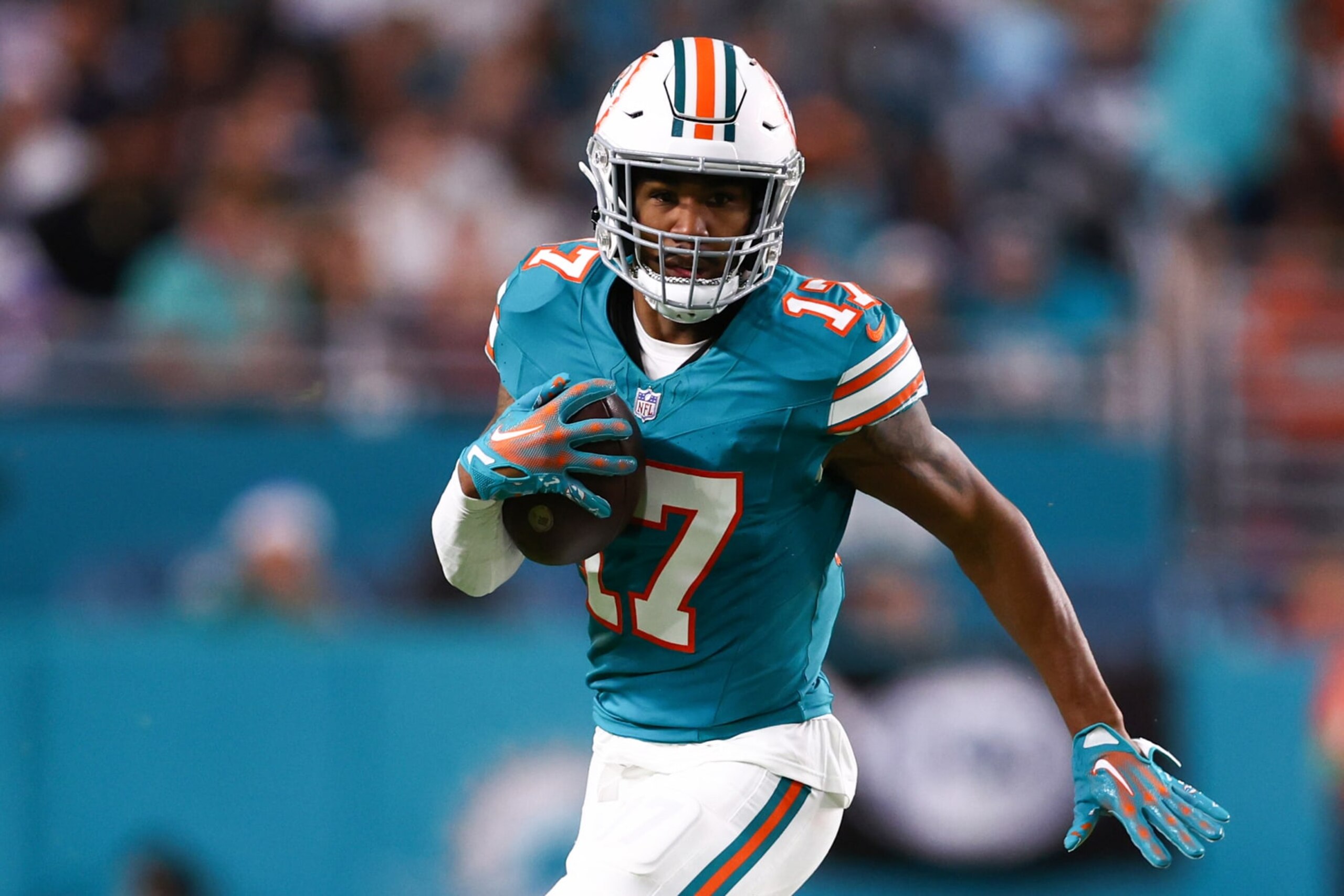 MIAMI GARDENS, FLORIDA - DECEMBER 24: Jaylen Waddle #17 of the Miami Dolphins runs the ball during the fourth quarter in the game against the Dallas Cowboys at Hard Rock Stadium on December 24, 2023 in Miami Gardens, Florida. (Photo by Megan Briggs/Getty Images)