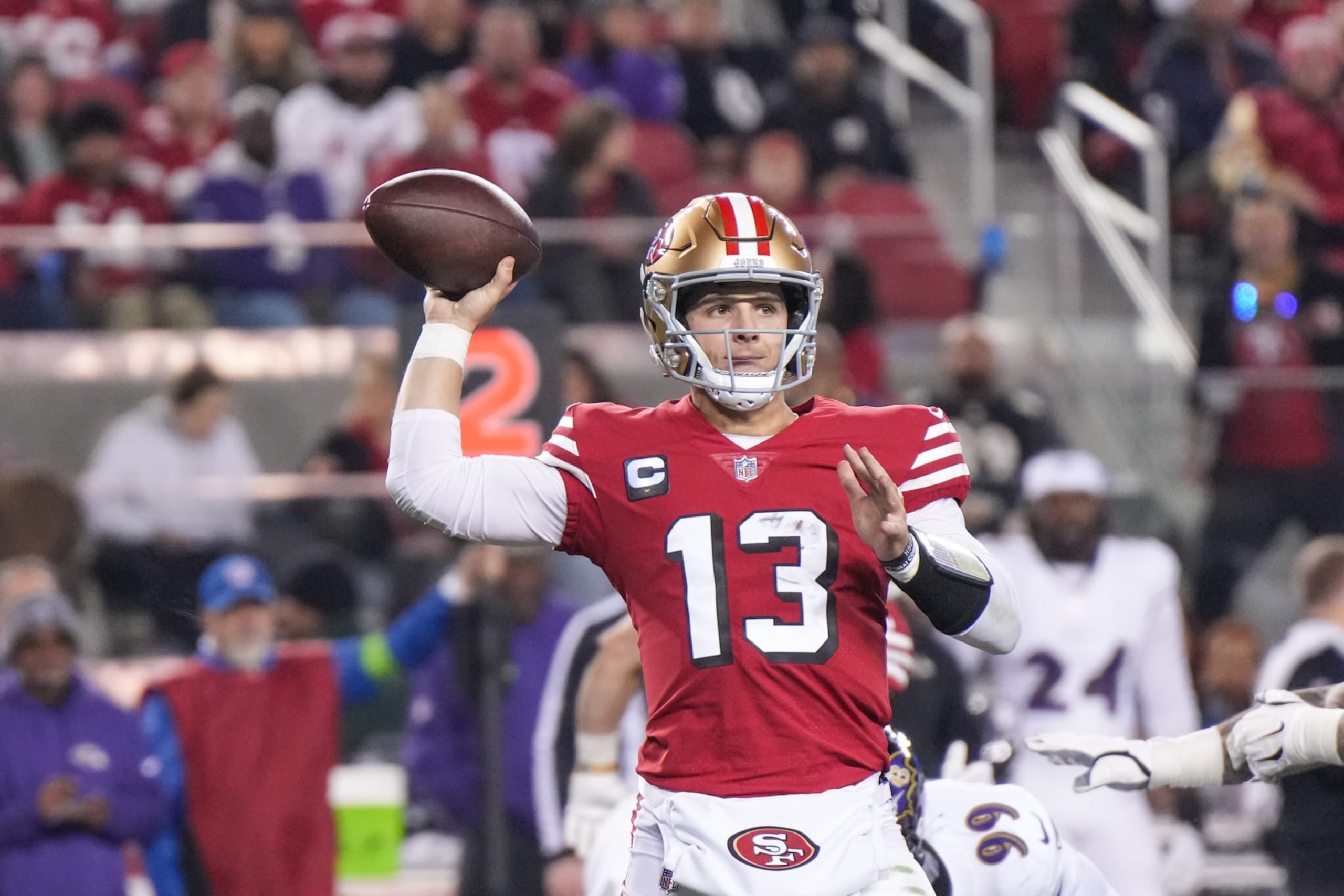 SANTA CLARA, CALIFORNIA - DECEMBER 25: Brock Purdy #13 of the San Francisco 49ers looks to pass during the first half against the Baltimore Ravens at Levi's Stadium on December 25, 2023 in Santa Clara, California. (Photo by Loren Elliott/Getty Images)