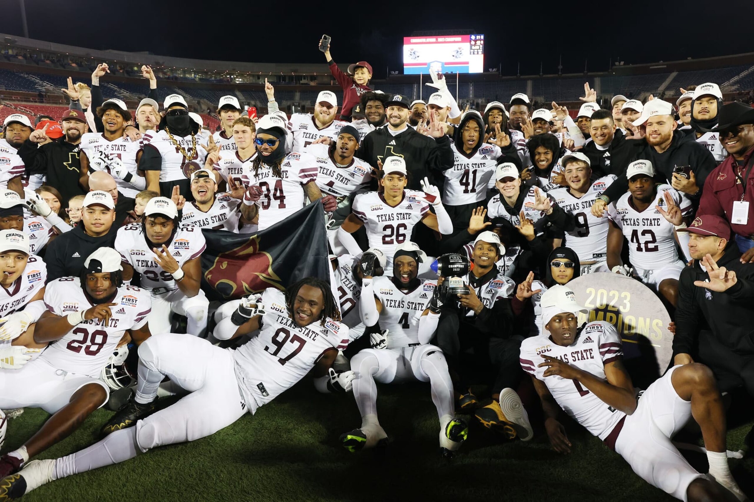 DALLAS, TEXAS - DECEMBER 26: The Texas State Bobcats pose for a team photo after defeating the Rice Owls during the SERVPRO First Responder Bowl at Gerald J. Ford Stadium on December 26, 2023 in Dallas, Texas. (Photo by Richard Rodriguez/Getty Images) DALLAS, TEXAS - DECEMBER 26: The Texas State Bobcats pose for a team photo after defeating the Rice Owls during the SERVPRO First Responder Bowl at Gerald J. Ford Stadium on December 26, 2023 in Dallas, Texas. (Photo by Richard Rodriguez/Getty Images)