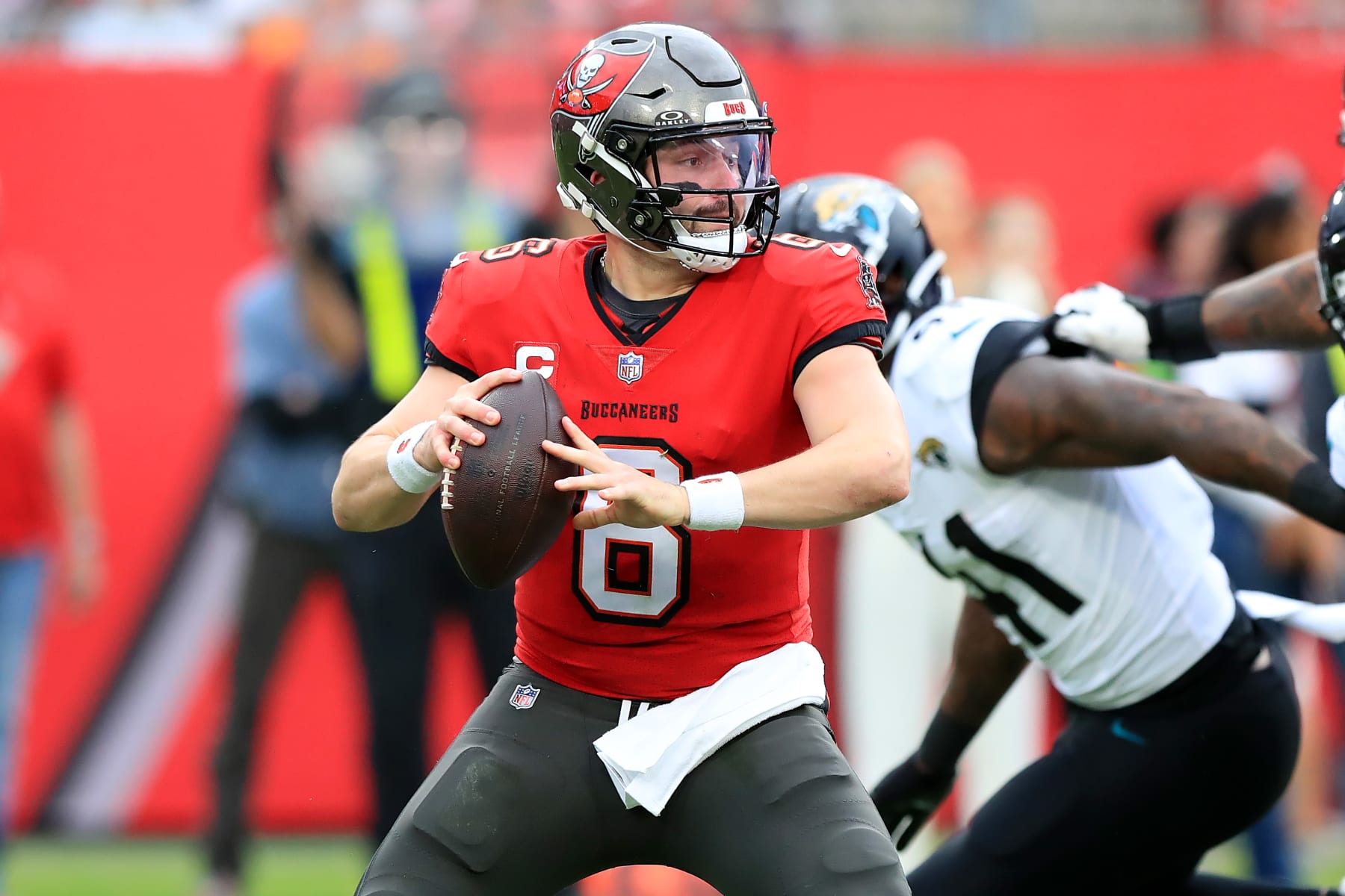 TAMPA, FL - DECEMBER 24: Tampa Bay Buccaneers Quarterback Baker Mayfield (6) looks for an open receiver during the regular season game between the Jacksonville Jaguars and the Tampa Bay Buccaneers on December 24, 2023 at Raymond James Stadium in Tampa, Florida. (Photo by Cliff Welch/Icon Sportswire via Getty Images)