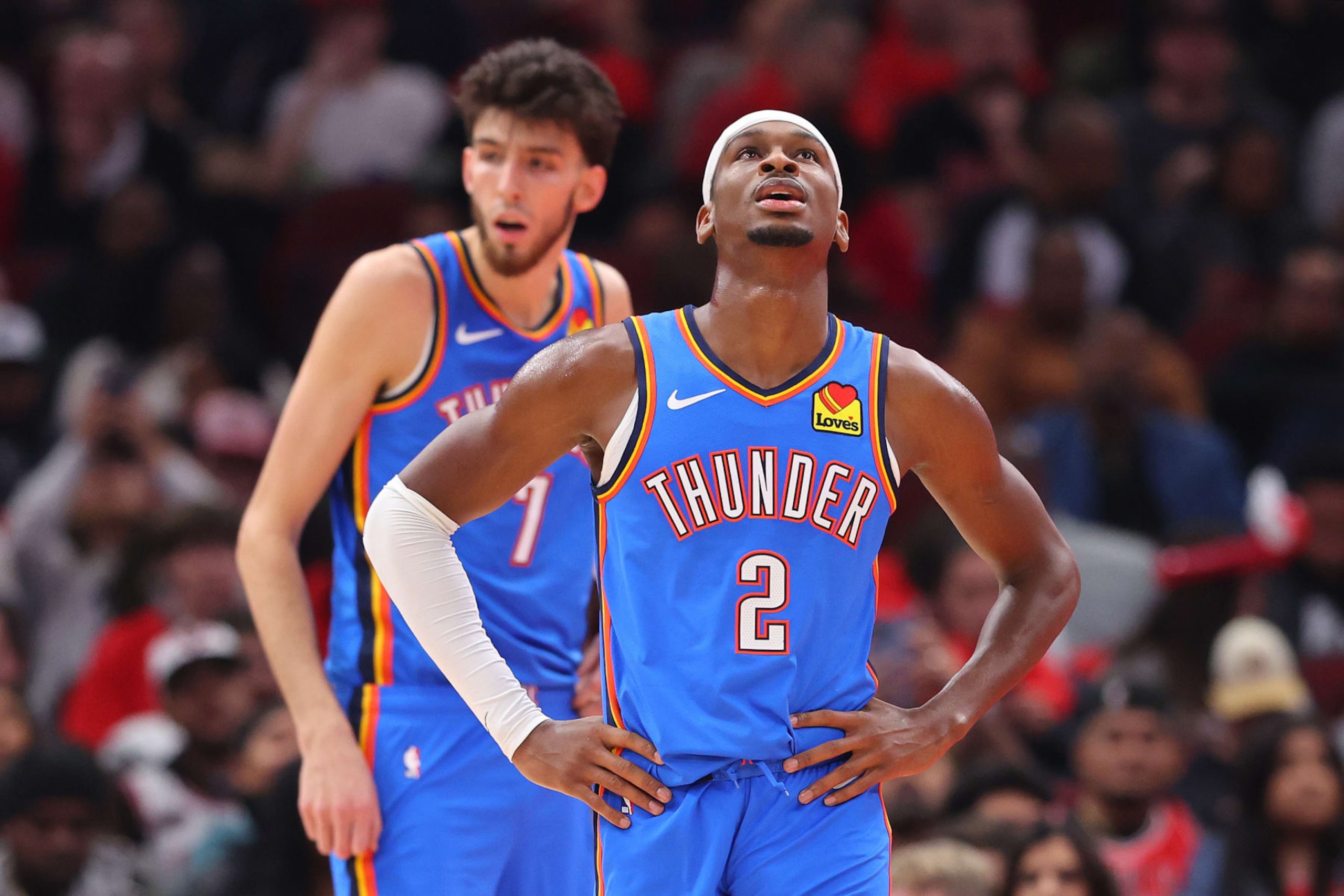 CHICAGO, ILLINOIS - OCTOBER 25: Chet Holmgren #7 and Shai Gilgeous-Alexander #2 of the Oklahoma City Thunder look on against the Chicago Bulls during the first half at the United Center on October 25, 2023 in Chicago, Illinois. NOTE TO USER: User expressly acknowledges and agrees that, by downloading and or using this photograph, User is consenting to the terms and conditions of the Getty Images License Agreement. (Photo by Michael Reaves/Getty Images)
