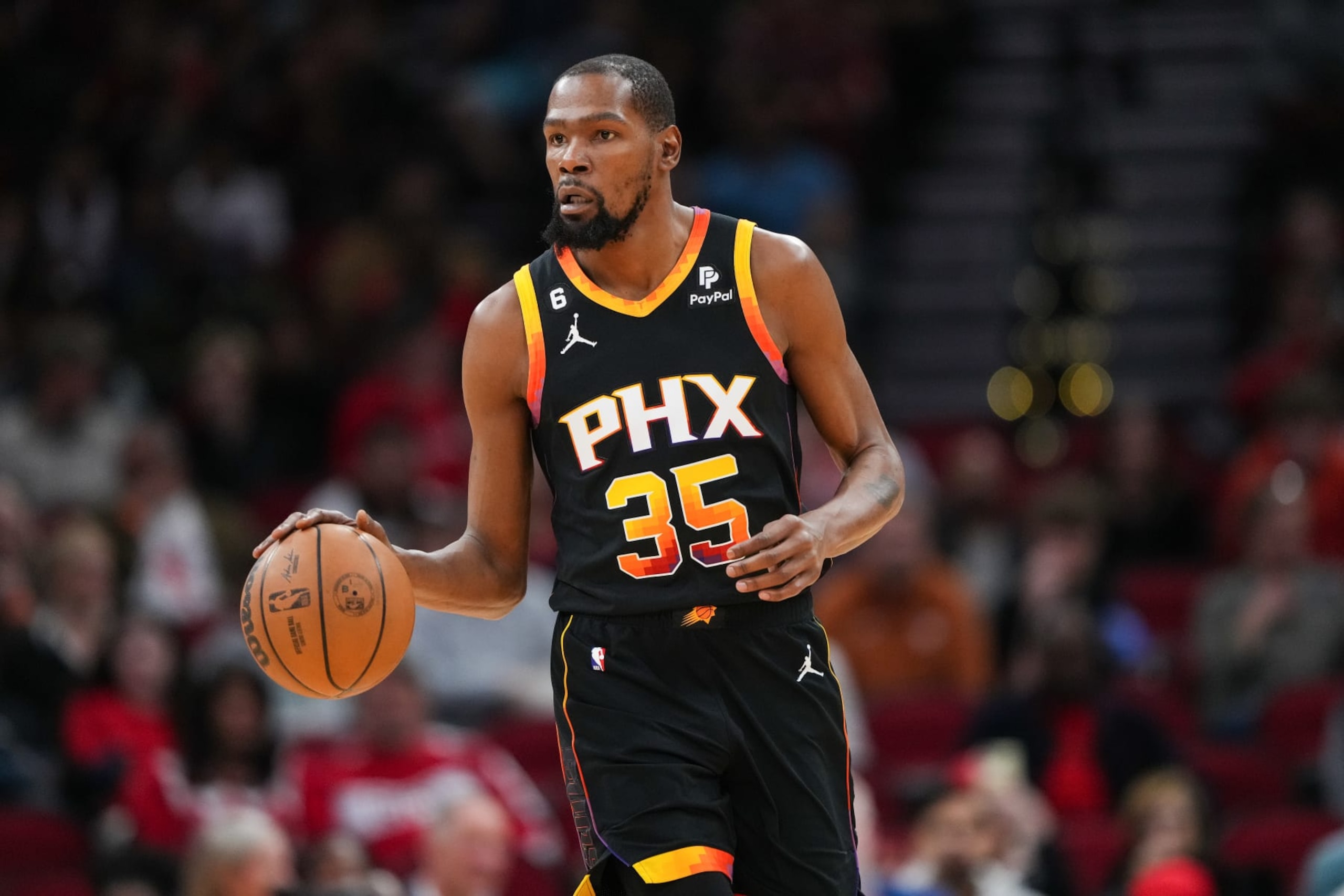 HOUSTON, TEXAS - DECEMBER 27: Kevin Durant #35 of the Phoenix Suns dribbles the ball during the first quarter of the game against the Houston Rockets at Toyota Center on December 27, 2023 in Houston, Texas. User expressly acknowledges and agrees that, by downloading and or using this photograph, User is consenting to the terms and conditions of the Getty Images License Agreement. (Photo by Alex Bierens de Haan/Getty Images)