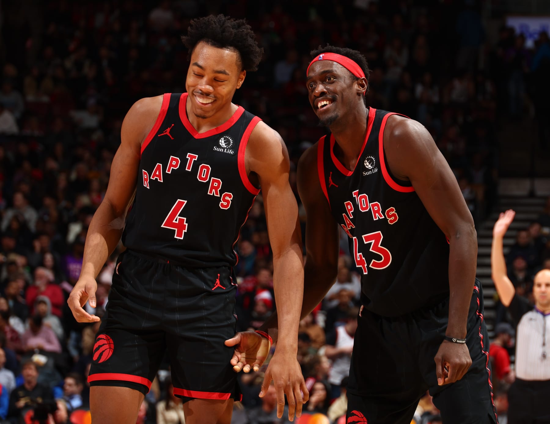 TORONTO, CANADA - DECEMBER 23:  Scottie Barnes #4 and Pascal Siakam #43 of the Toronto Raptors smile during the game against the Utah Jazz on December 23, 2023 at the Scotiabank Arena in Toronto, Ontario, Canada.  NOTE TO USER: User expressly acknowledges and agrees that, by downloading and or using this Photograph, user is consenting to the terms and conditions of the Getty Images License Agreement.  Mandatory Copyright Notice: Copyright 2023 NBAE (Photo by Vaughn Ridley/NBAE via Getty Images)