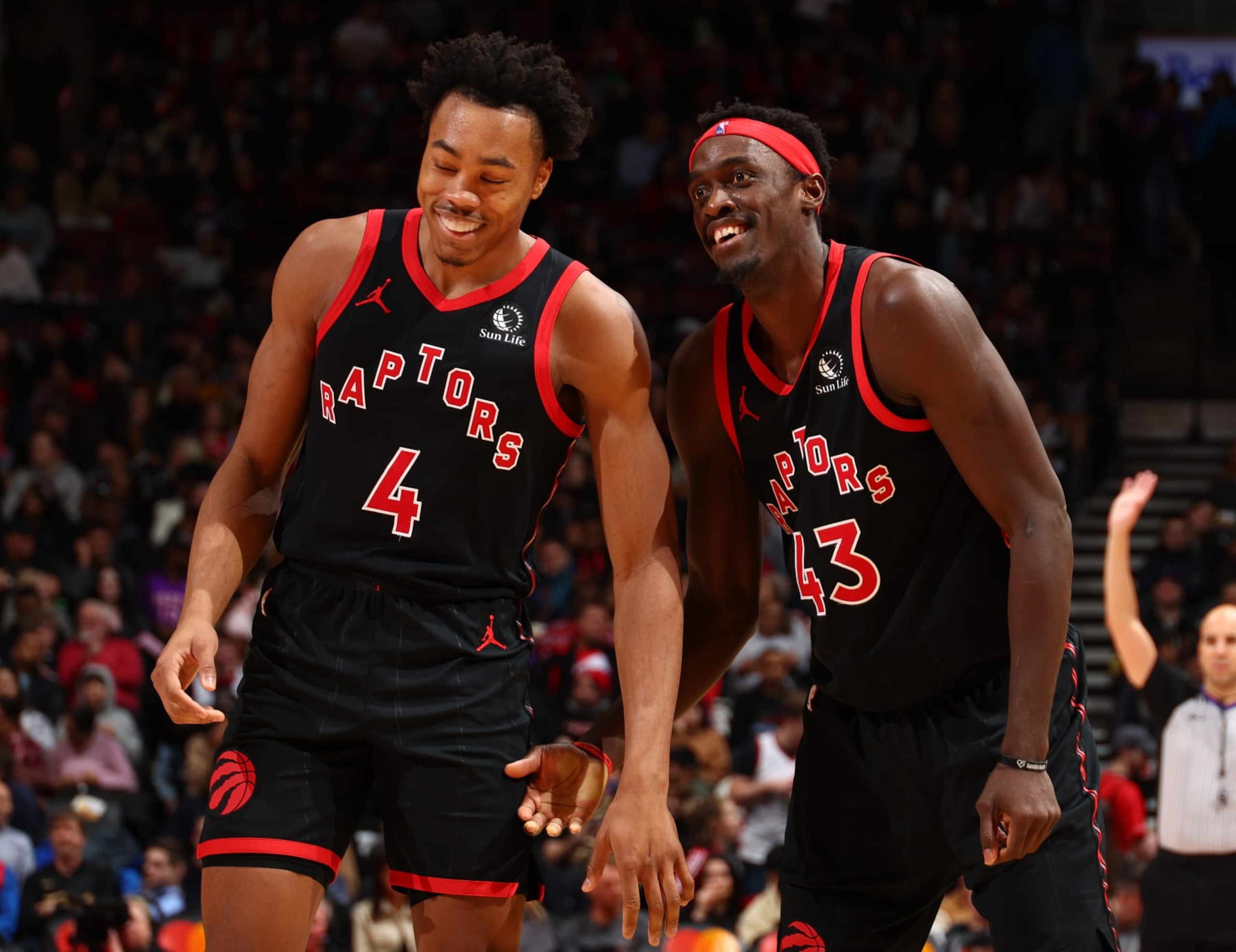 TORONTO, CANADA - DECEMBER 23:  Scottie Barnes #4 and Pascal Siakam #43 of the Toronto Raptors smile during the game against the Utah Jazz on December 23, 2023 at the Scotiabank Arena in Toronto, Ontario, Canada.  NOTE TO USER: User expressly acknowledges and agrees that, by downloading and or using this Photograph, user is consenting to the terms and conditions of the Getty Images License Agreement.  Mandatory Copyright Notice: Copyright 2023 NBAE (Photo by Vaughn Ridley/NBAE via Getty Images)