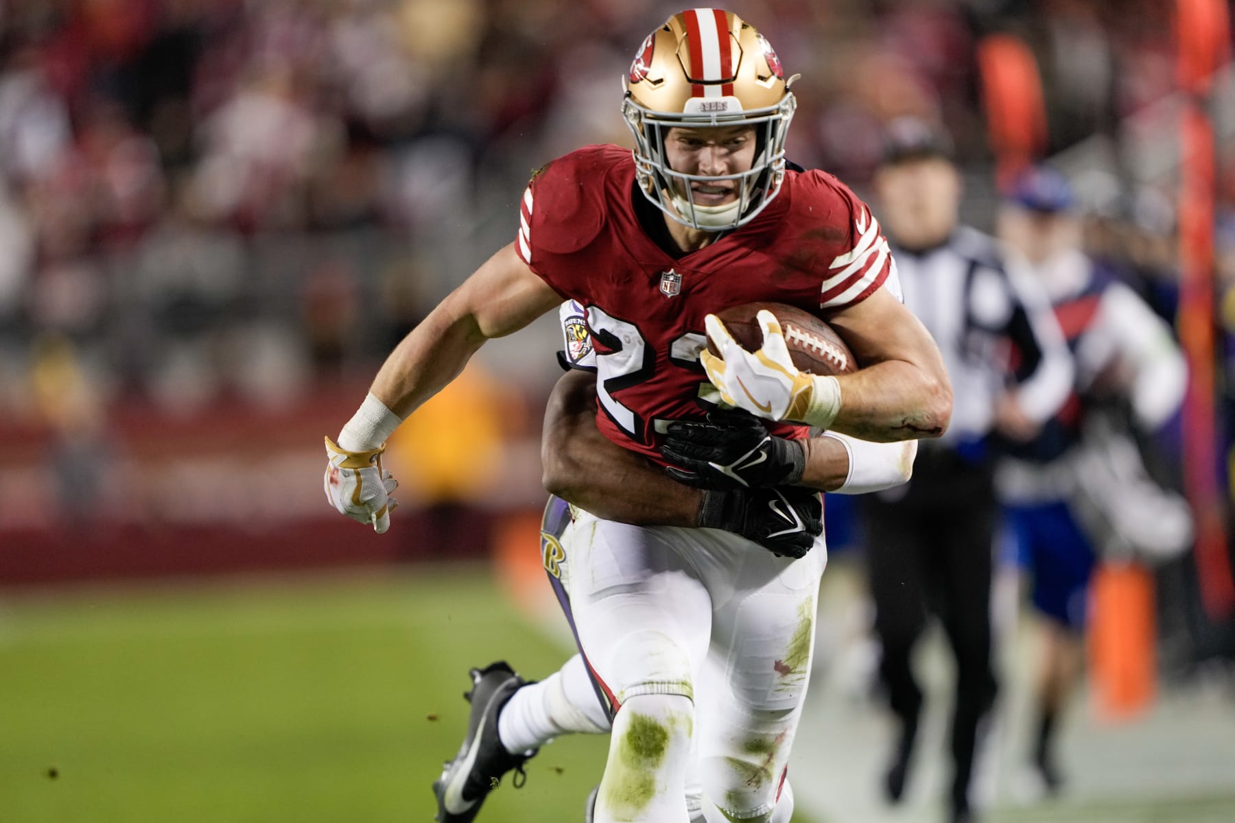 SANTA CLARA, CALIFORNIA - DECEMBER 25: Christian McCaffrey #23 of the San Francisco 49ers runs the ball during the second quarter against the Baltimore Ravens at Levi's Stadium on December 25, 2023 in Santa Clara, California. (Photo by Thearon W. Henderson/Getty Images)