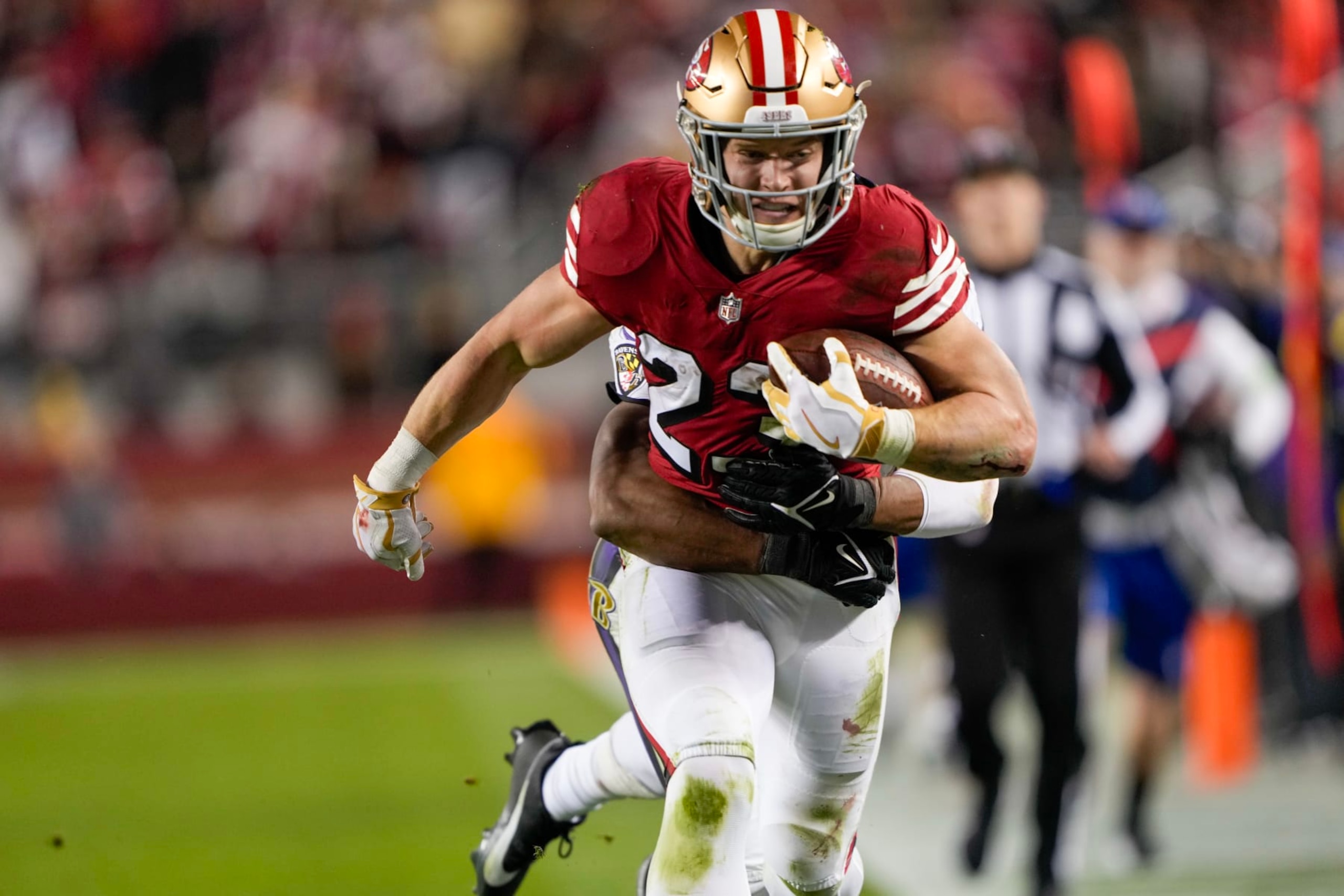 SANTA CLARA, CALIFORNIA - DECEMBER 25: Christian McCaffrey #23 of the San Francisco 49ers runs the ball during the second quarter against the Baltimore Ravens at Levi's Stadium on December 25, 2023 in Santa Clara, California. (Photo by Thearon W. Henderson/Getty Images)
