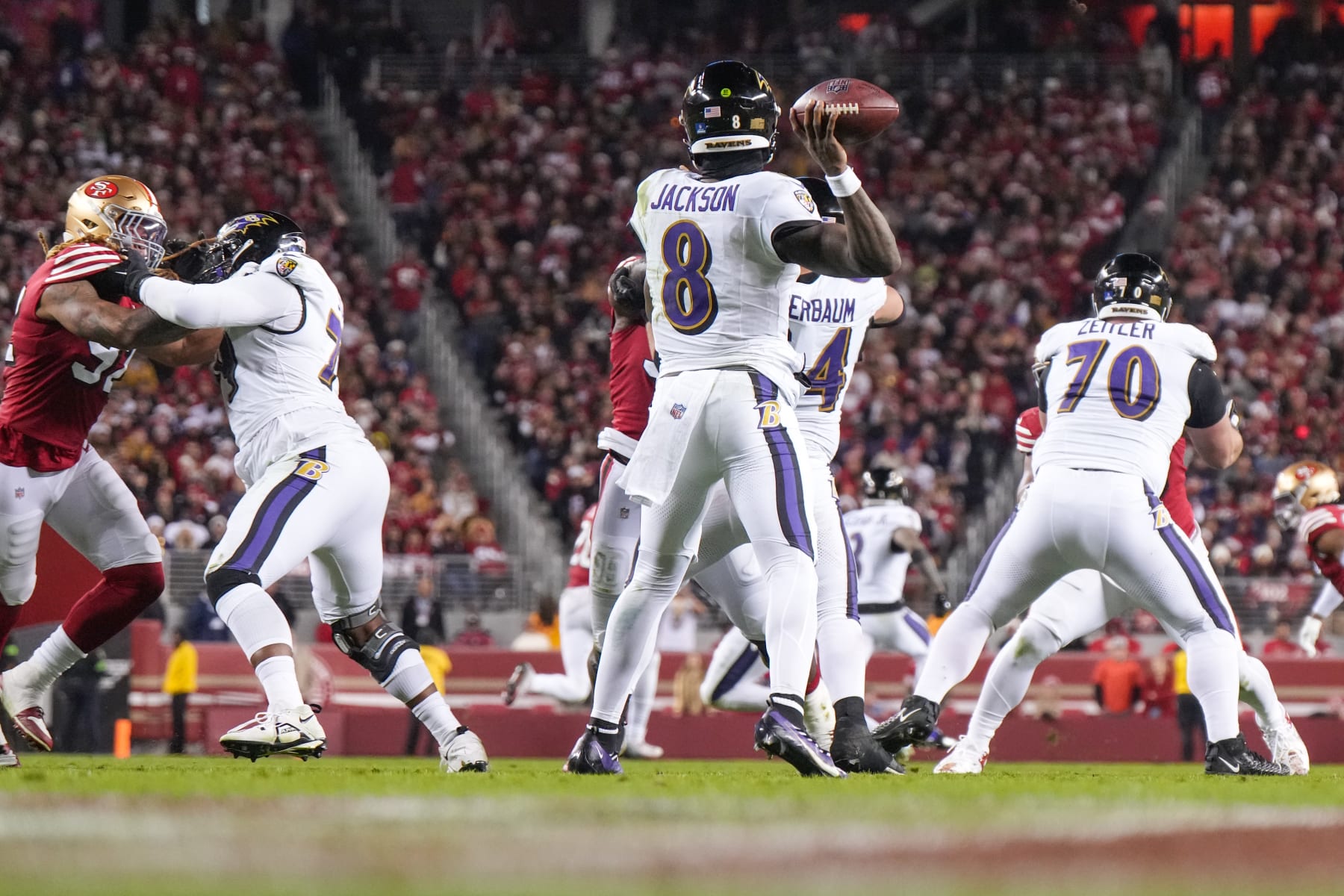 SANTA CLARA, CALIFORNIA - DECEMBER 25: Lamar Jackson #8 of the Baltimore Ravens looks to pass against the San Francisco 49ers during the second half at Levi's Stadium on December 25, 2023 in Santa Clara, California. (Photo by Loren Elliott/Getty Images)