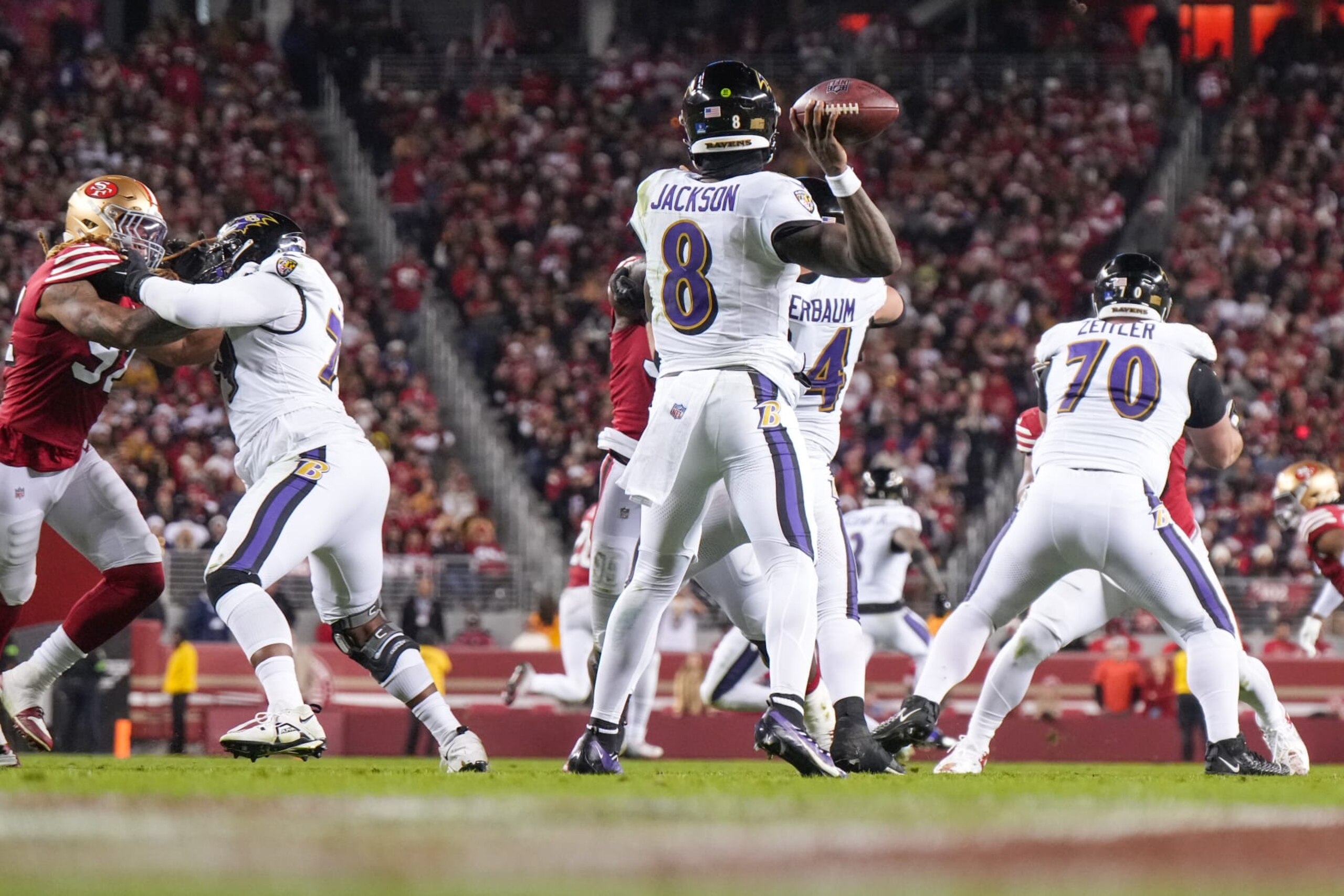 SANTA CLARA, CALIFORNIA - DECEMBER 25: Lamar Jackson #8 of the Baltimore Ravens looks to pass against the San Francisco 49ers during the second half at Levi's Stadium on December 25, 2023 in Santa Clara, California. (Photo by Loren Elliott/Getty Images)