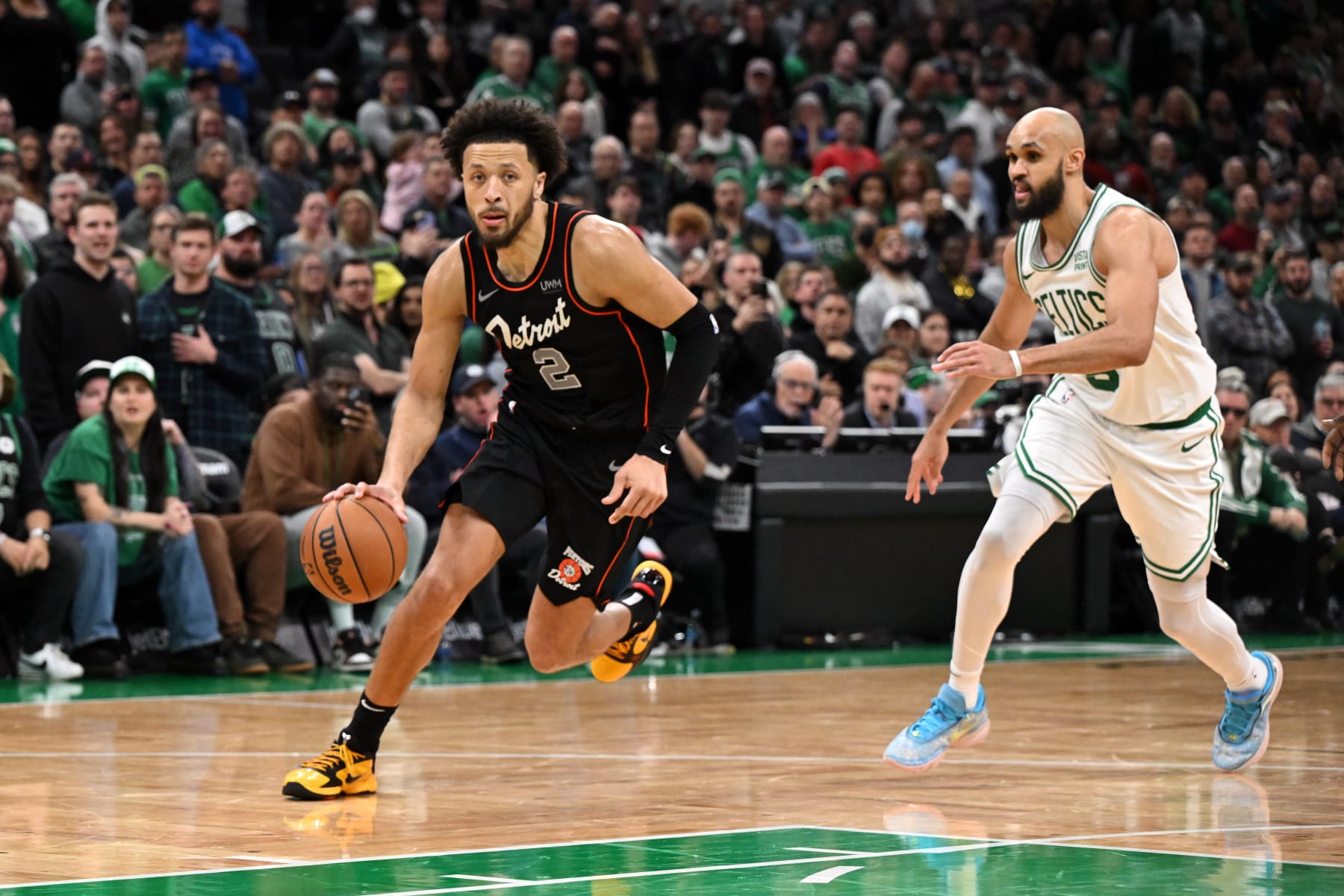BOSTON, MASSACHUSETTS - DECEMBER 28: Cade Cunningham #2 of the Detroit Pistons drives to the basket against Derrick White #9 of the Boston Celtics during overtime at TD Garden on December 28, 2023 in Boston, Massachusetts. NOTE TO USER: User expressly acknowledges and agrees that, by downloading and or using this photograph, User is consenting to the terms and conditions of the Getty Images License Agreement. (Photo by Brian Fluharty/Getty Images)
