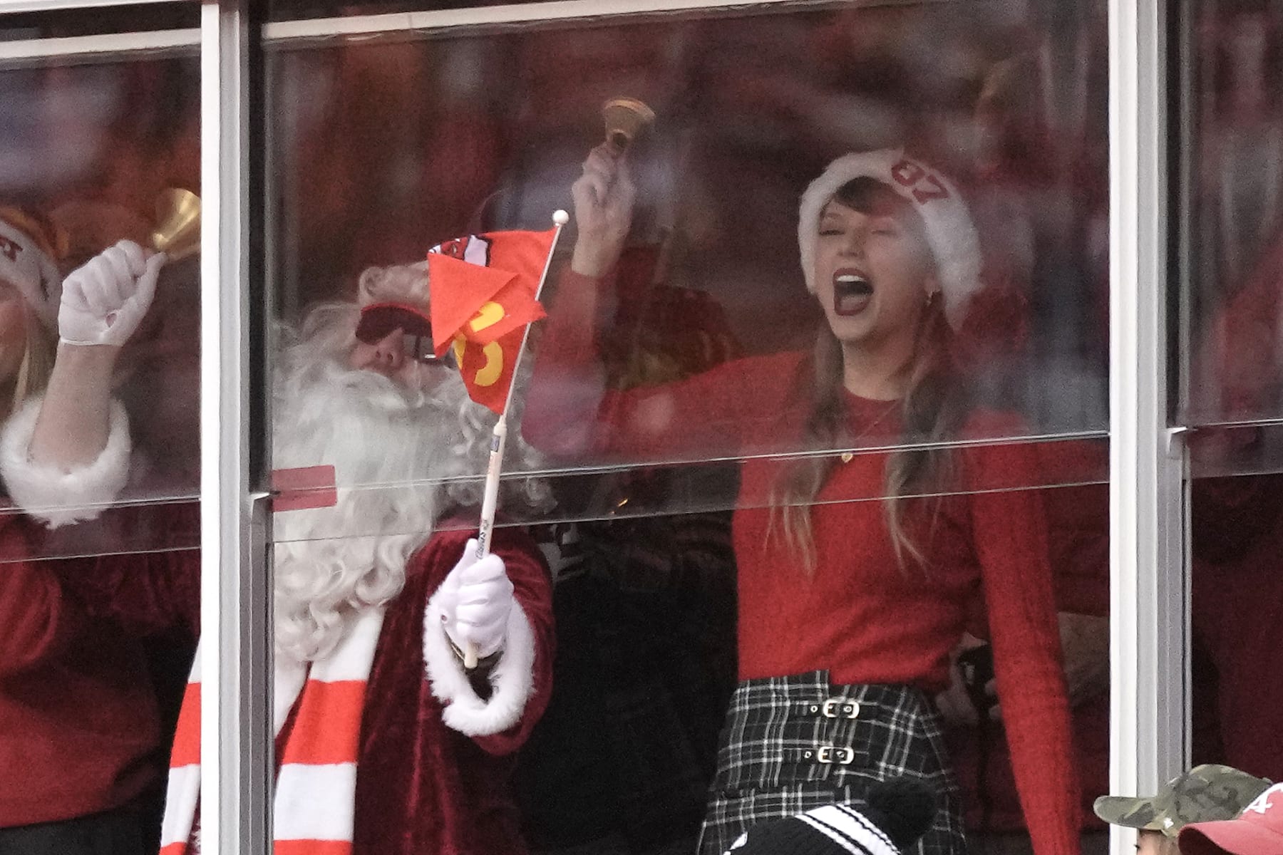Taylor Swift watches during the first half of an NFL football game between the Kansas City Chiefs and the Las Vegas Raiders Monday, Dec. 25, 2023, in Kansas City, Mo. (AP Photo/Charlie Riedel)