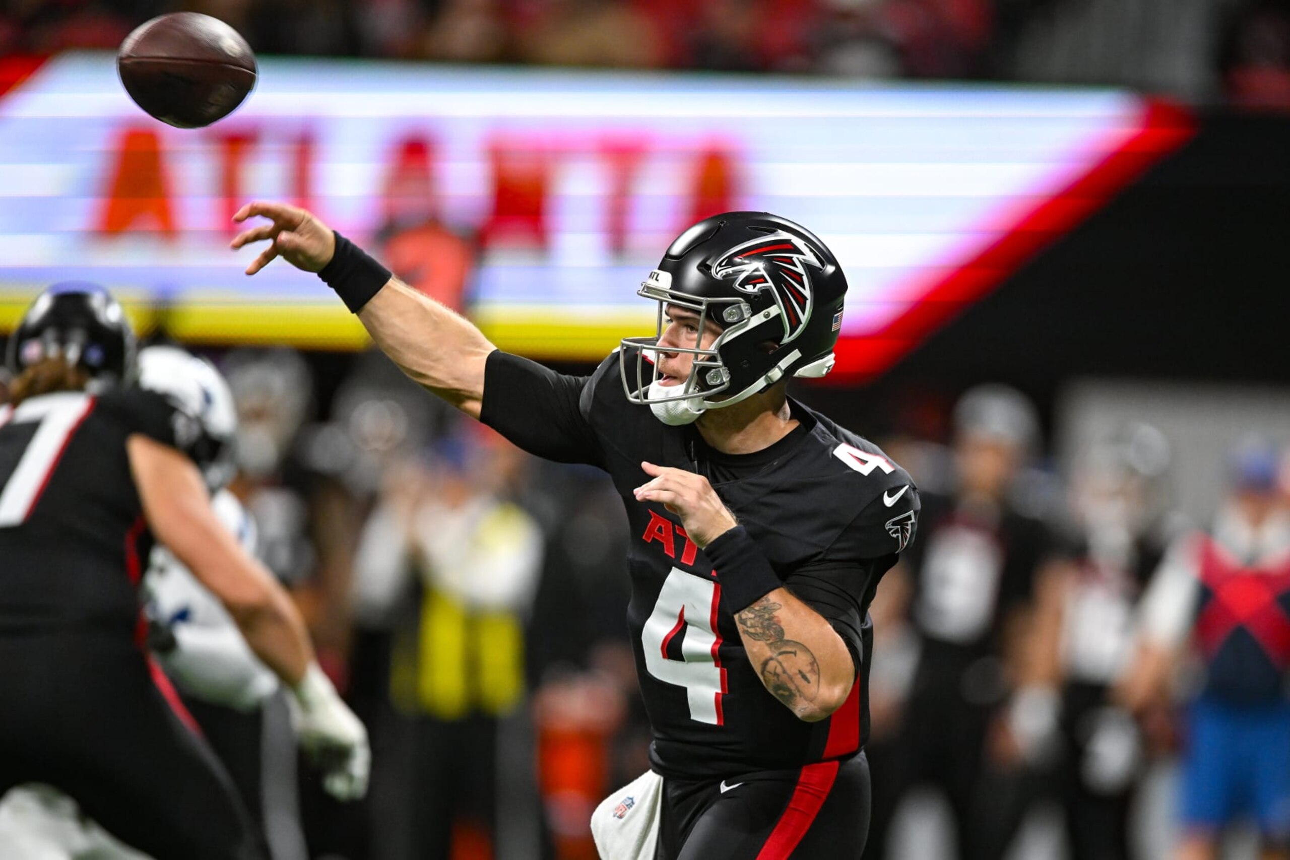 ATLANTA, GA  DECEMBER 24:  Atlanta quarterback Taylor Heinicke (4) throws a pass during the NFL game between the Indianapolis Colts and the Atlanta Falcons on December 24th, 2023 at Mercedes-Benz Stadium in Atlanta, GA.  (Photo by Rich von Biberstein/Icon Sportswire via Getty Images)