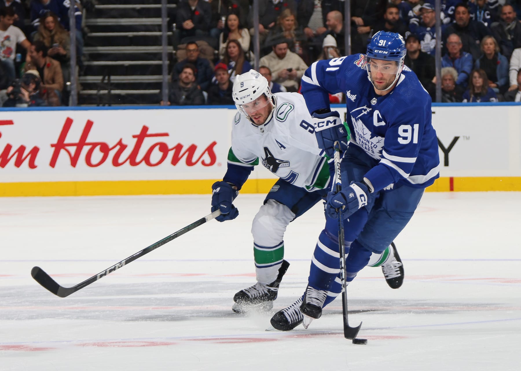 Vancouver Canucks forward J.T. Miller (left) and Toronto Maple Leafs captain John Tavares. 