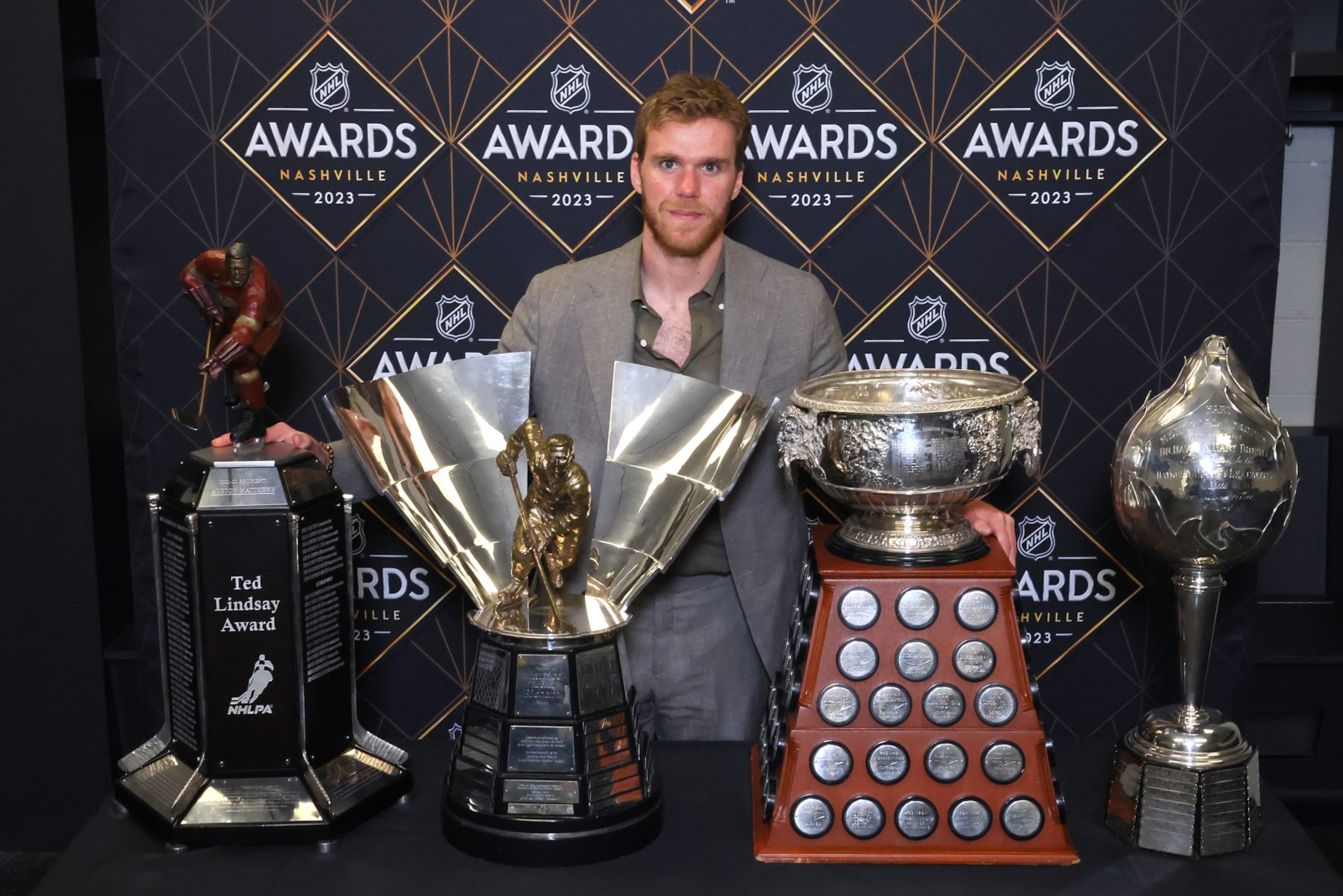 NASHVILLE, TENNESSEE - JUNE 26: Connor McDavid of the Edmonton Oilers poses with the Ted Lindsay Award, Maurice Richard Trophy, Art Ross Trophy and the Hart Trophy during the 2023 NHL Awards at Bridgestone Arena on June 26, 2023 in Nashville, Tennessee. (Photo by Bruce Bennett/Getty Images)