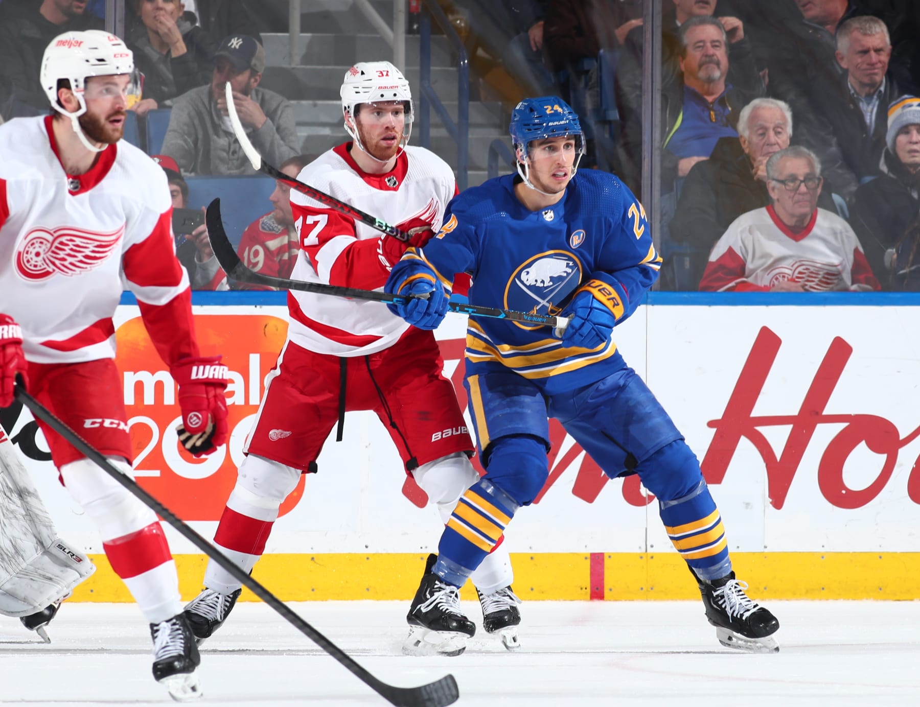 BUFFALO, NEW YORK - DECEMBER 5: Dylan Cozens #24 of the Buffalo Sabres skates against J.T. Compher #37 of the Detroit Red Wings during an NHL game on December 5, 2023 at KeyBank Center in Buffalo, New York. (Photo by Bill Wippert/NHLI via Getty Images)