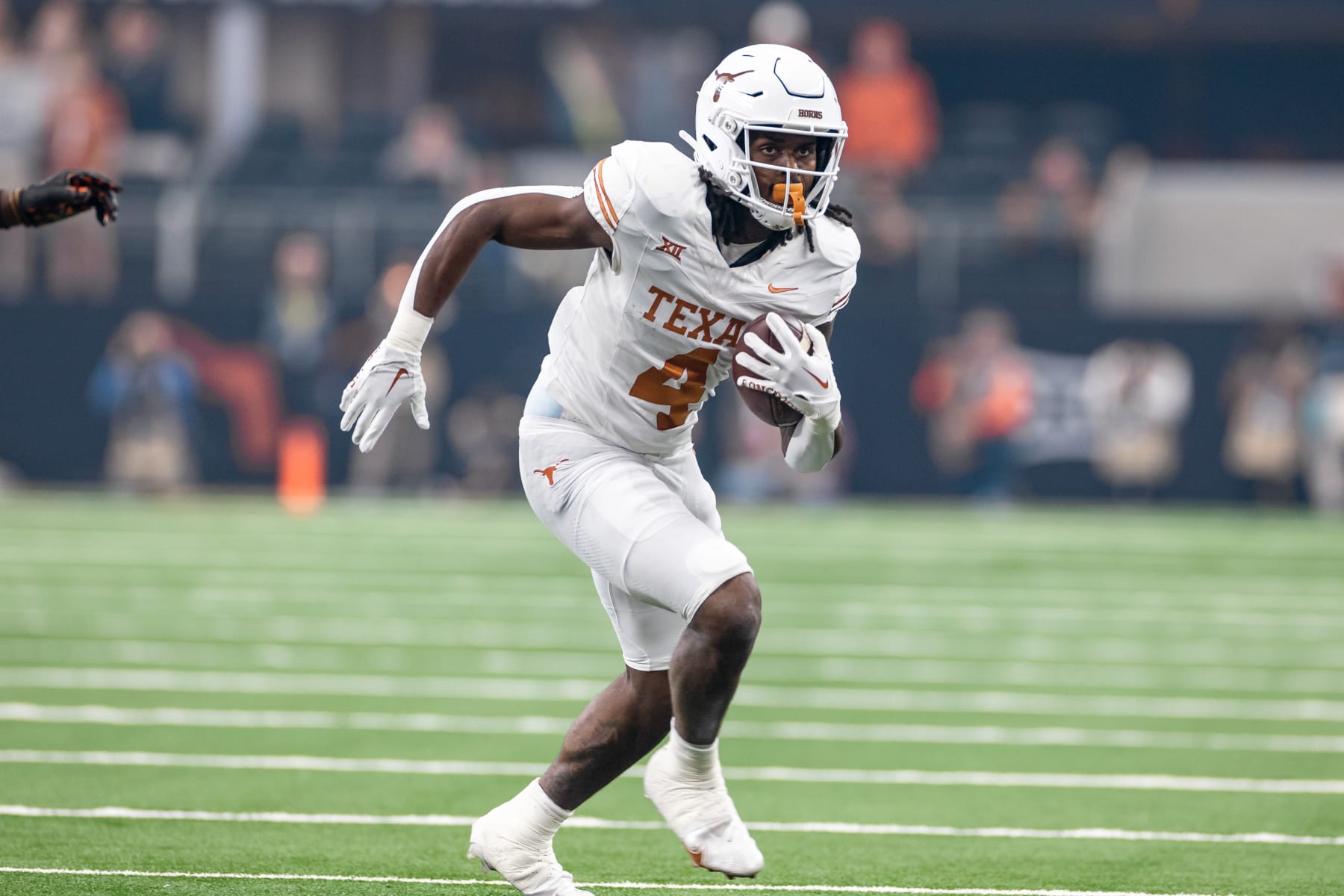 ARLINGTON, TX - DECEMBER 02: Texas Longhorns running back CJ Baxter (#4) runs up field during the Big 12 Championship football game between the Texas Longhorns and Oklahoma State Cowboys on December 02, 2023 at AT&T Studium in Arlington, Texas. (Photo by Matthew Visinsky/Icon Sportswire via Getty Images)