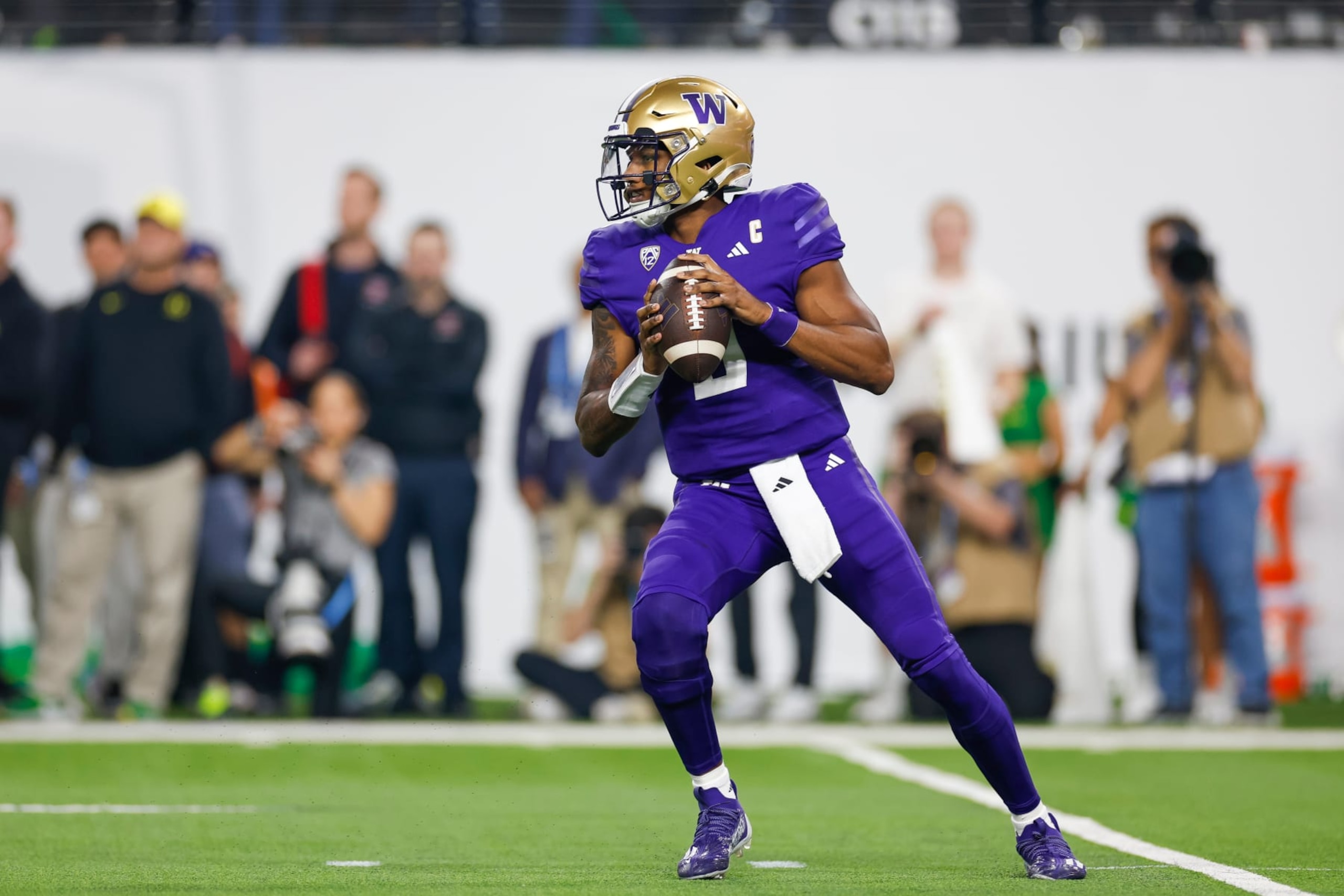 LAS VEGAS, NEVADA - DECEMBER 1: Michael Penix Jr. #9 of the Washington Huskies looks for an open receiver during the Pac-12 Championship game against the Oregon Ducks at Allegiant Stadium on December 1, 2023 in Las Vegas, Nevada. (Photo by Brandon Sloter/Image Of Sport/Getty Images)