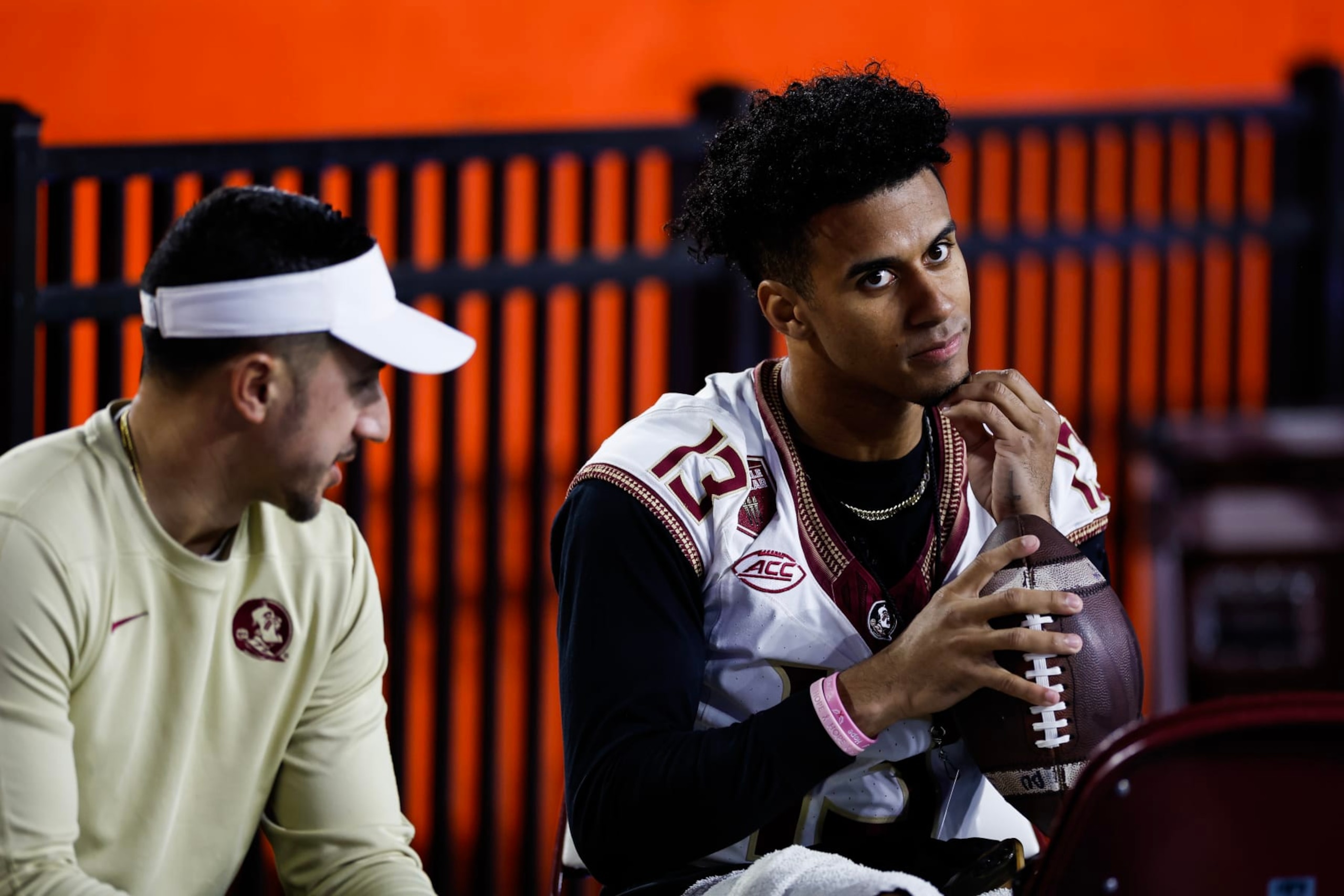 GAINESVILLE, FLORIDA - NOVEMBER 25: Jordan Travis #13 of the Florida State Seminoles looks on from the Seminoles bench before the start of a game against the Florida Gators at Ben Hill Griffin Stadium on November 25, 2023 in Gainesville, Florida. (Photo by James Gilbert/Getty Images)