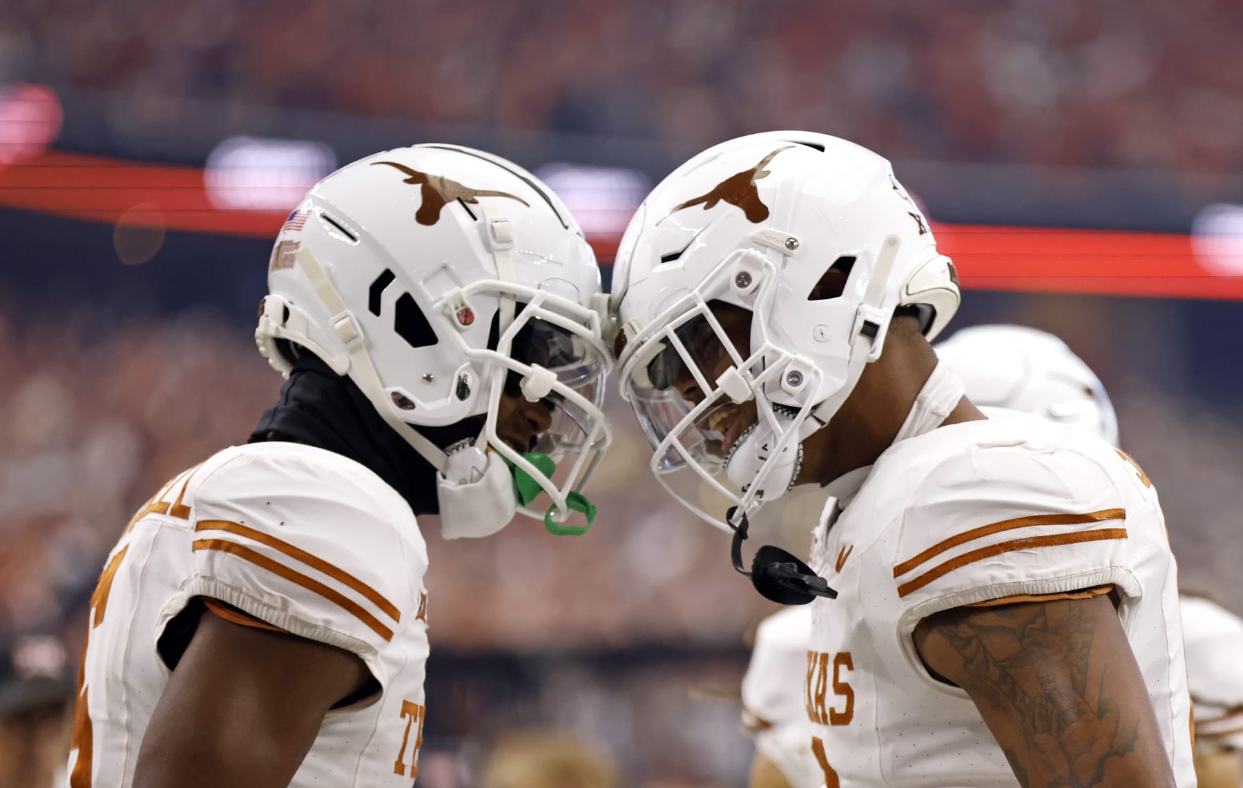 ARLINGTON, TX - DECEMBER 2: Wide receiver Adonai Mitchell #5 and tight end Ja'Tavion Sanders #0 of the Texas Longhorns celebrate a touchdown against the Oklahoma State Cowboys in the first half of the Big 12  Championship at AT&T Stadium on December 2, 2023 in Arlington, Texas.  (Photo by Ron Jenkins/Getty Images)