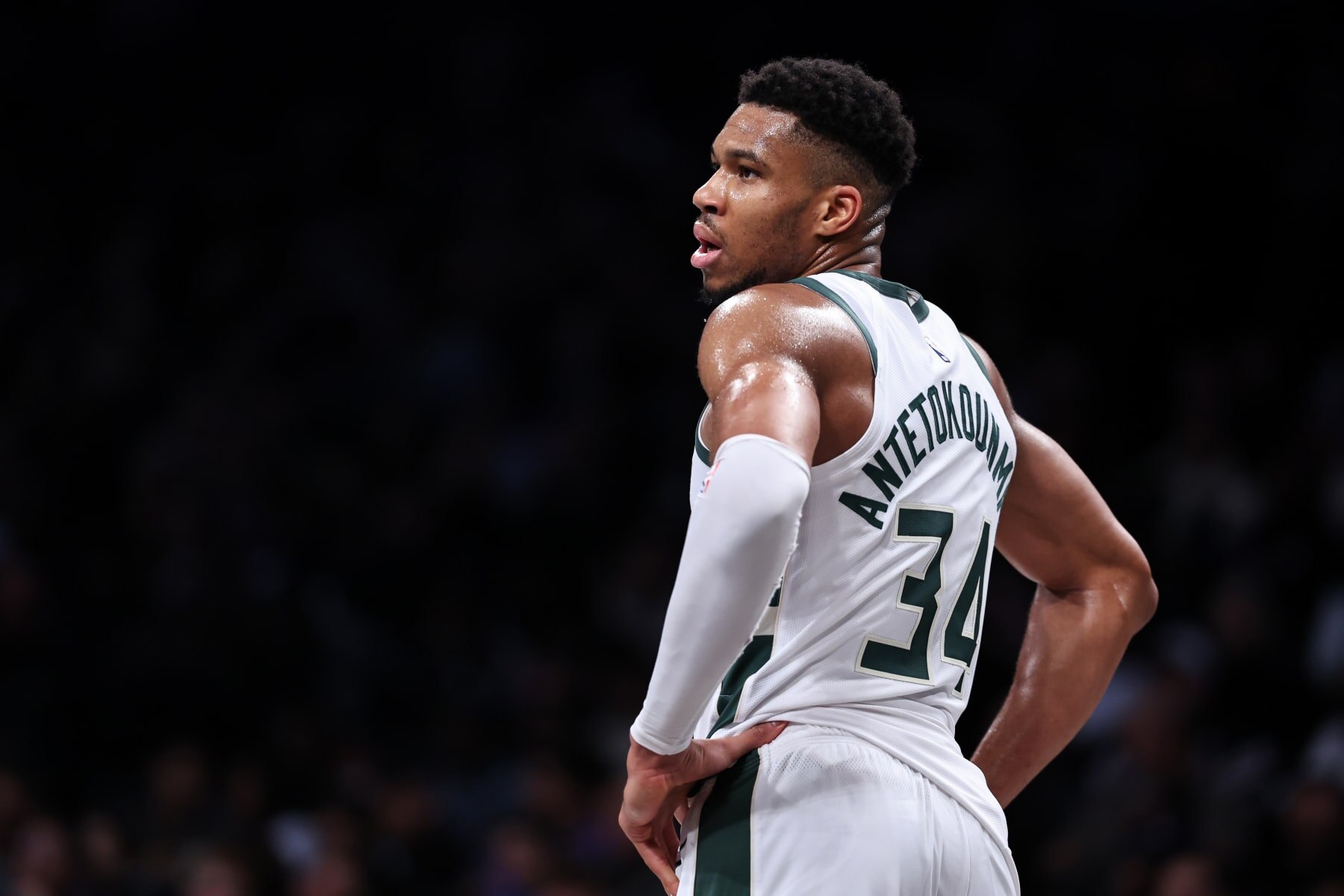 NEW YORK, NEW YORK - DECEMBER 27: Giannis Antetokounmpo #34 of the Milwaukee Bucks looks on during the third quarter of the game against the Brooklyn Nets at Barclays Center on December 27, 2023 in New York City. NOTE TO USER: User expressly acknowledges and agrees that, by downloading and or using this photograph, User is consenting to the terms and conditions of the Getty Images License Agreement. (Photo by Dustin Satloff/Getty Images)