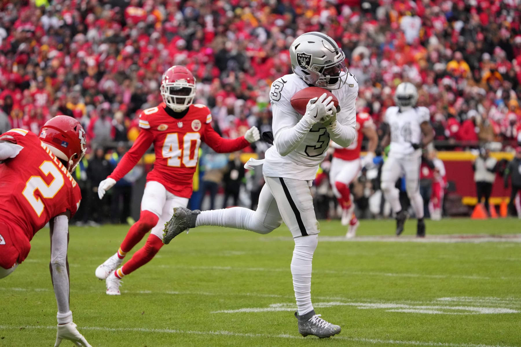 KANSAS CITY, MISSOURI - DECEMBER 25: Las Vegas Raiders wide receiver DeAndre Carter (3) catches a pass against the Kansas City Chiefs during an NFL football game on December 25, 2023 in Kansas City, Missouri. The Raiders defeated the Chiefs 20-14.  (Photo by Kirby Lee/Getty Images)