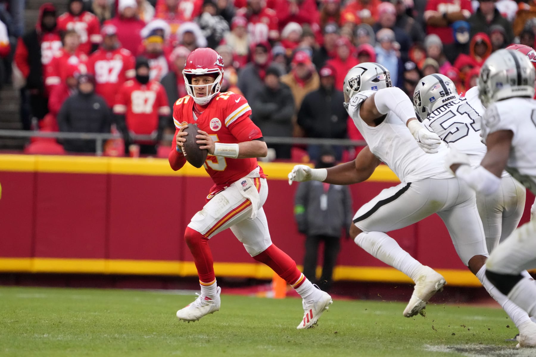 KANSAS CITY, MISSOURI - DECEMBER 25: Kansas City Chiefs quarterback Patrick Mahomes (15) throws the ball against the Las Vegas Raiders during an NFL football game on December 25, 2023 in Kansas City, Missouri. The Raiders defeated the Chiefs 20-14.  (Photo by Kirby Lee/Getty Images)