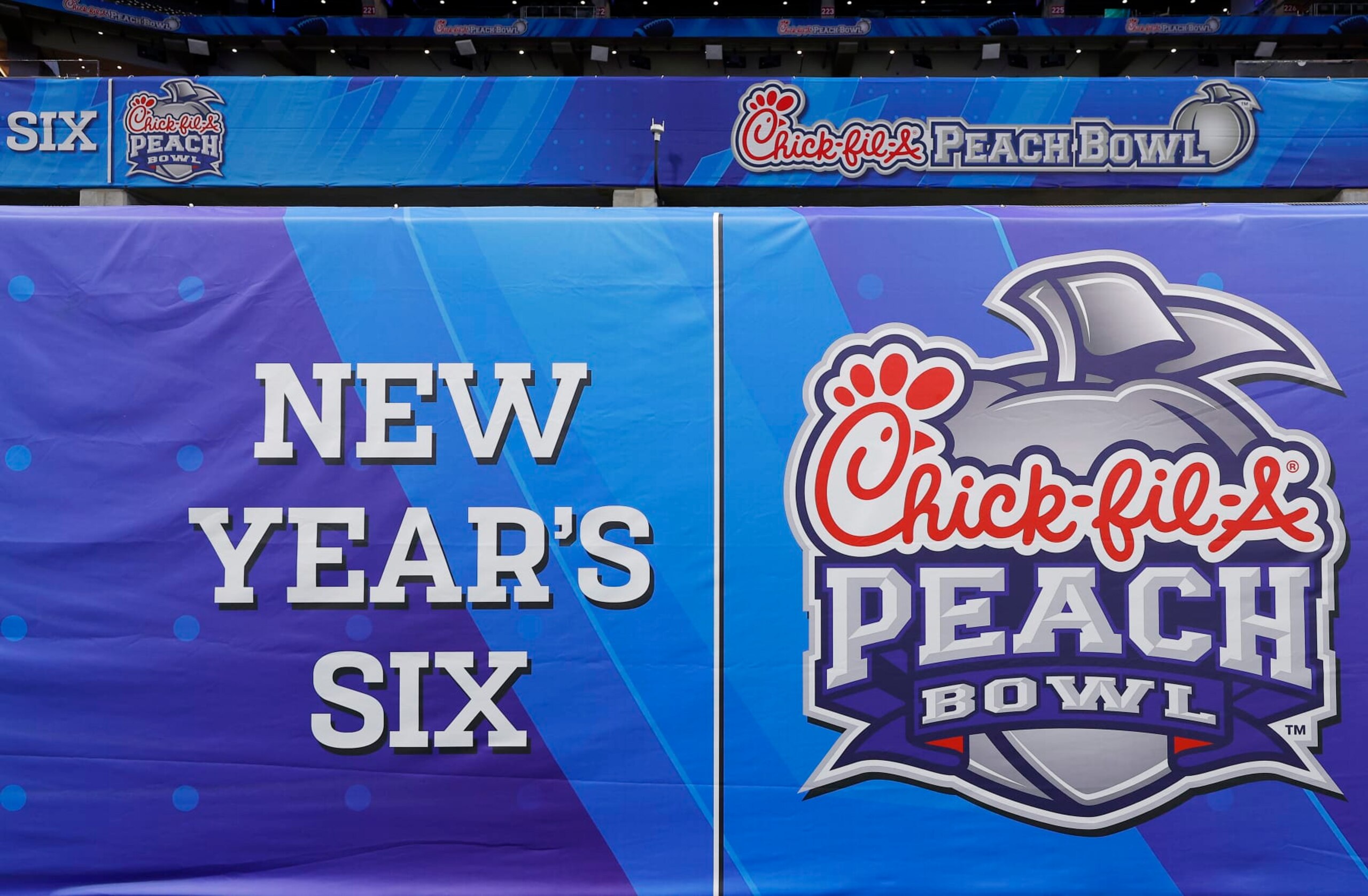 ATLANTA, GEORGIA - DECEMBER 30: A general view of the football field and signage before the Chick-fil-A Peach Bowl at Mercedes-Benz Stadium on December 30, 2023 in Atlanta, Georgia. (Photo by Todd Kirkland/Getty Images) ATLANTA, GEORGIA - DECEMBER 30: A general view of the football field and signage before the Chick-fil-A Peach Bowl at Mercedes-Benz Stadium on December 30, 2023 in Atlanta, Georgia. (Photo by Todd Kirkland/Getty Images)