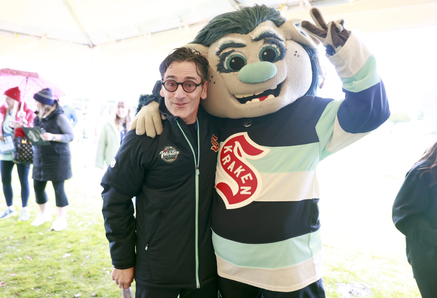 SEATTLE, WASHINGTON - DECEMBER 30: (L-R) Victor de Bonis, President, Seattle Kraken, and Kraken mascot Buoy attend the 2024 Discover NHL Winter Classic Legacy Project at Verlo Playfield on December 30, 2023 in Seattle, Washington. (Photo by Jeff Vinnick/NHLI via Getty Images)