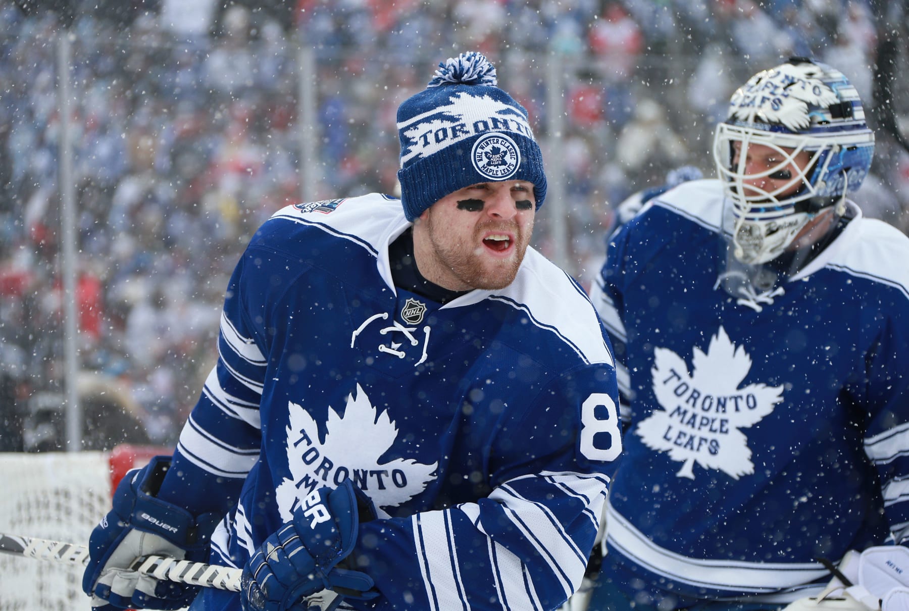 ANN ARBOR, MI - JANUARY 01:  Phil Kessel #81 and goaltender James Reimer #34 of the Toronto Maple Leafs skate during warm-up prior to the 2014 Bridgestone NHL Winter Classic on January 1, 2014 at Michigan Stadium in Ann Arbor, Michigan. The Maple Leafs defeated the Red Wings 3-2 in shootout overtime.  (Photo by Dave Sandford/NHLI via Getty Images)