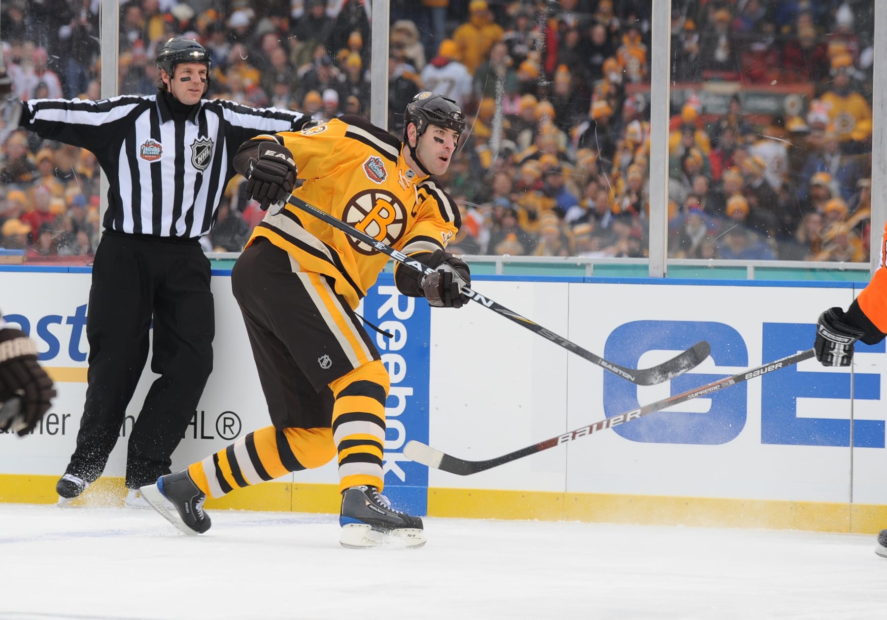 BOSTON - JANUARY 1: Zdeno Chara #33 of the Boston Bruins shoots the puck against the Philadelphia Flyers in the 2010 Bridgestone Winter Classic at Fenway Park on January 1, 2010 in Boston, Massachusetts. (Photo by Brian Babineau/NHLI via Getty Images)