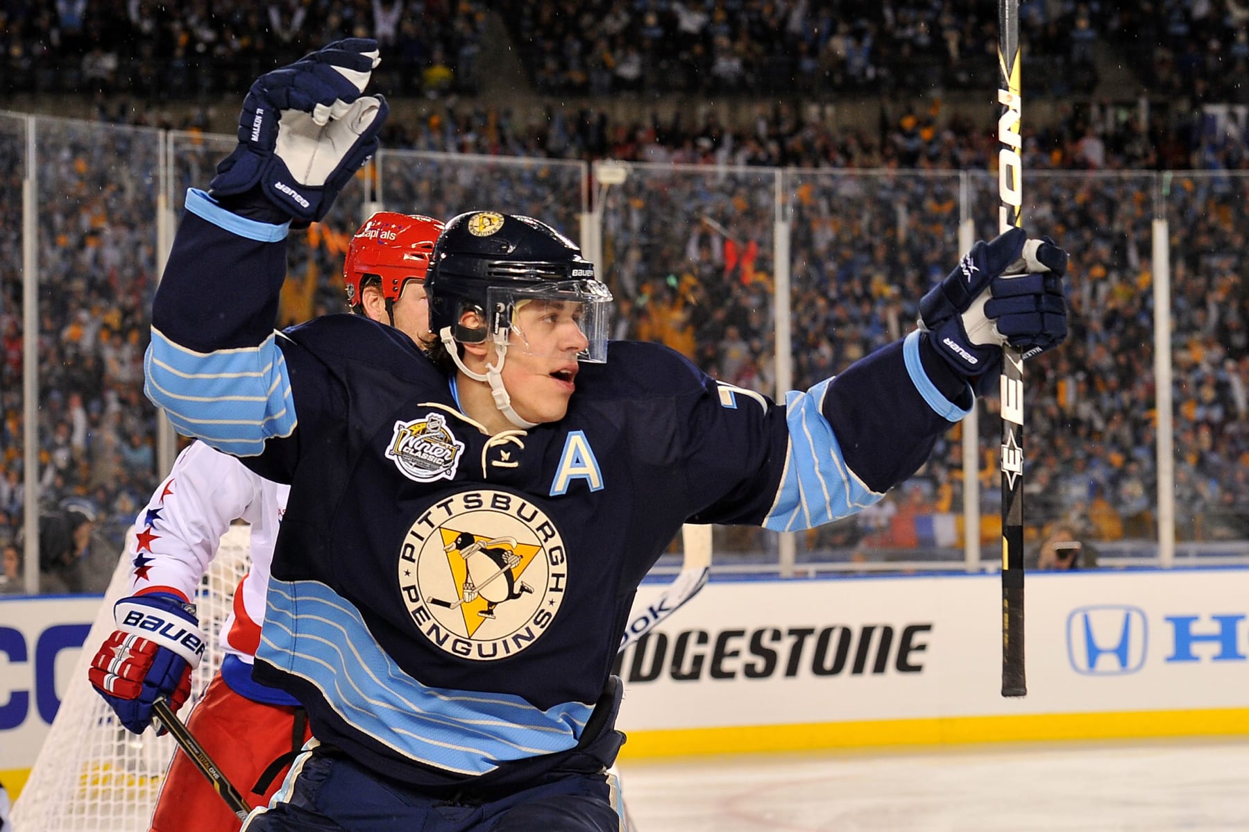 PITTSBURGH, PA - JANUARY 01:  Evgeni Malkin #71 of the Pittsburgh Penguins celebrates after scoring a goal against the Washington Capitals in the 2nd period during the 2011 NHL Bridgestone Winter Classic at Heinz Field on January 1, 2011 in Pittsburgh, Pennsylvania.  (Photo by Brian Babineau/NHLI via Getty Images)