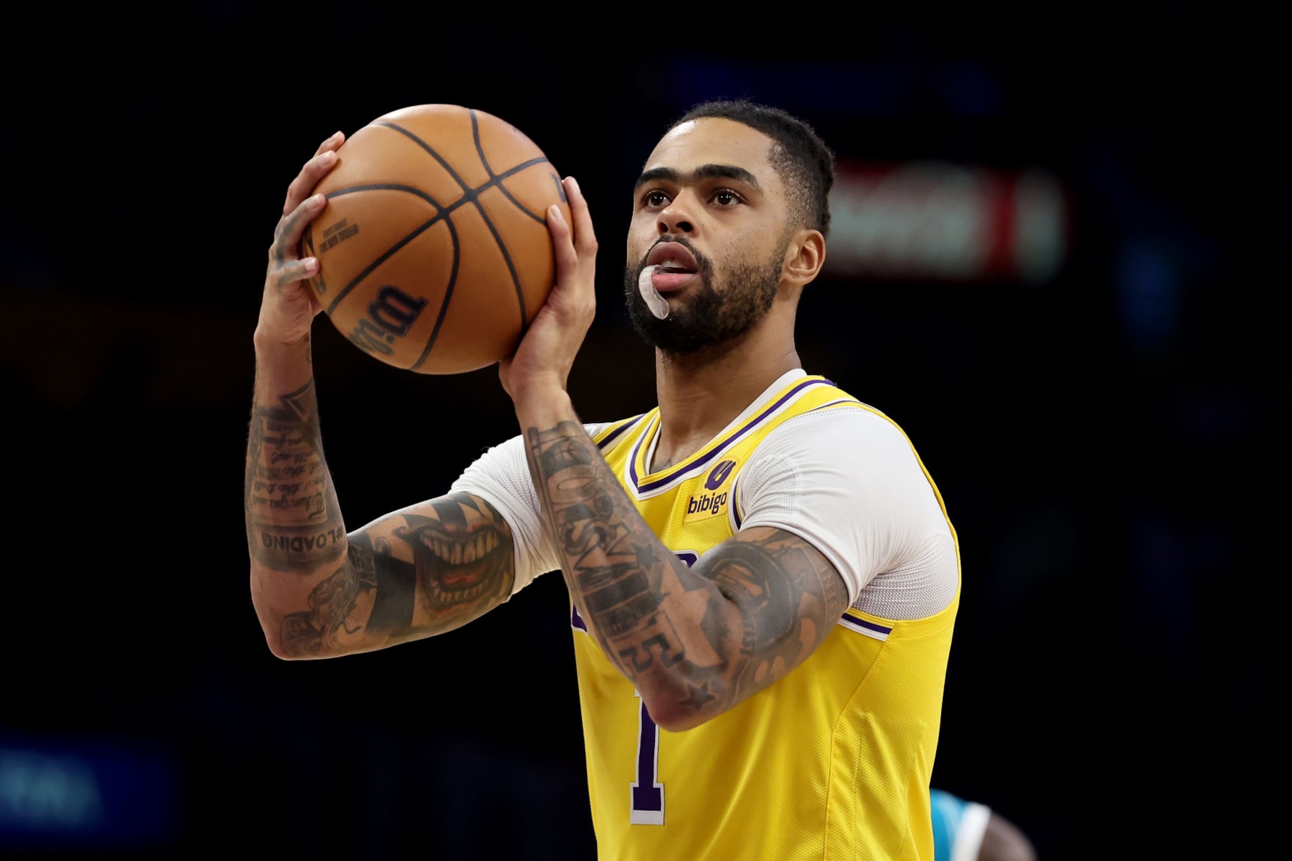 LOS ANGELES, CALIFORNIA - DECEMBER 28: D'Angelo Russell #1 of the Los Angeles Lakers takes a free throw during the second half of a game against the Charlotte Hornets at Crypto.com Arena on December 28, 2023 in Los Angeles, California. NOTE TO USER: User expressly acknowledges and agrees that, by downloading and or using this photograph, User is consenting to the terms and conditions of the Getty Images License Agreement. (Photo by Sean M. Haffey/Getty Images) LOS ANGELES, CALIFORNIA - DECEMBER 28: D'Angelo Russell #1 of the Los Angeles Lakers takes a free throw during the second half of a game against the Charlotte Hornets at Crypto.com Arena on December 28, 2023 in Los Angeles, California. NOTE TO USER: User expressly acknowledges and agrees that, by downloading and or using this photograph, User is consenting to the terms and conditions of the Getty Images License Agreement. (Photo by Sean M. Haffey/Getty Images)