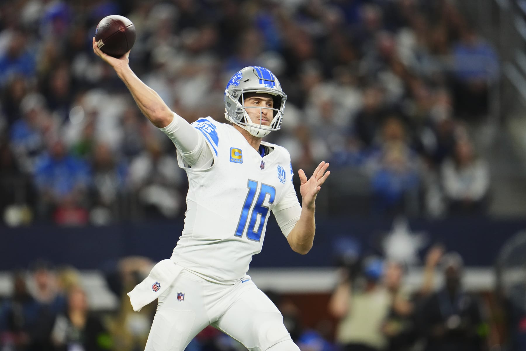 ARLINGTON, TX - DECEMBER 30: Jared Goff #16 of the Detroit Lions drops back to pass against the Dallas Cowboys during the first half at AT&T Stadium on December 30, 2023 in Arlington, Texas. (Photo by Cooper Neill/Getty Images)