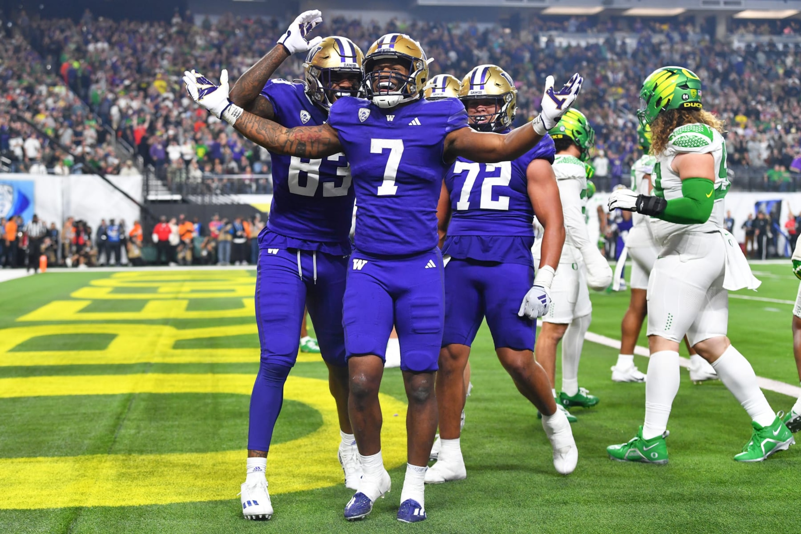 LAS VEGAS, NV - DECEMBER 01: Washington Huskies running back Dillon Johnson (7) celebrates after scoring a touchdown during the Pac-12 Conference championship game between the Oregon Ducks and the Washington Huskies on December 1, 2023 at Allegiant Stadium in Las Vegas, Nevada. (Photo by Brian Rothmuller/Icon Sportswire via Getty Images)