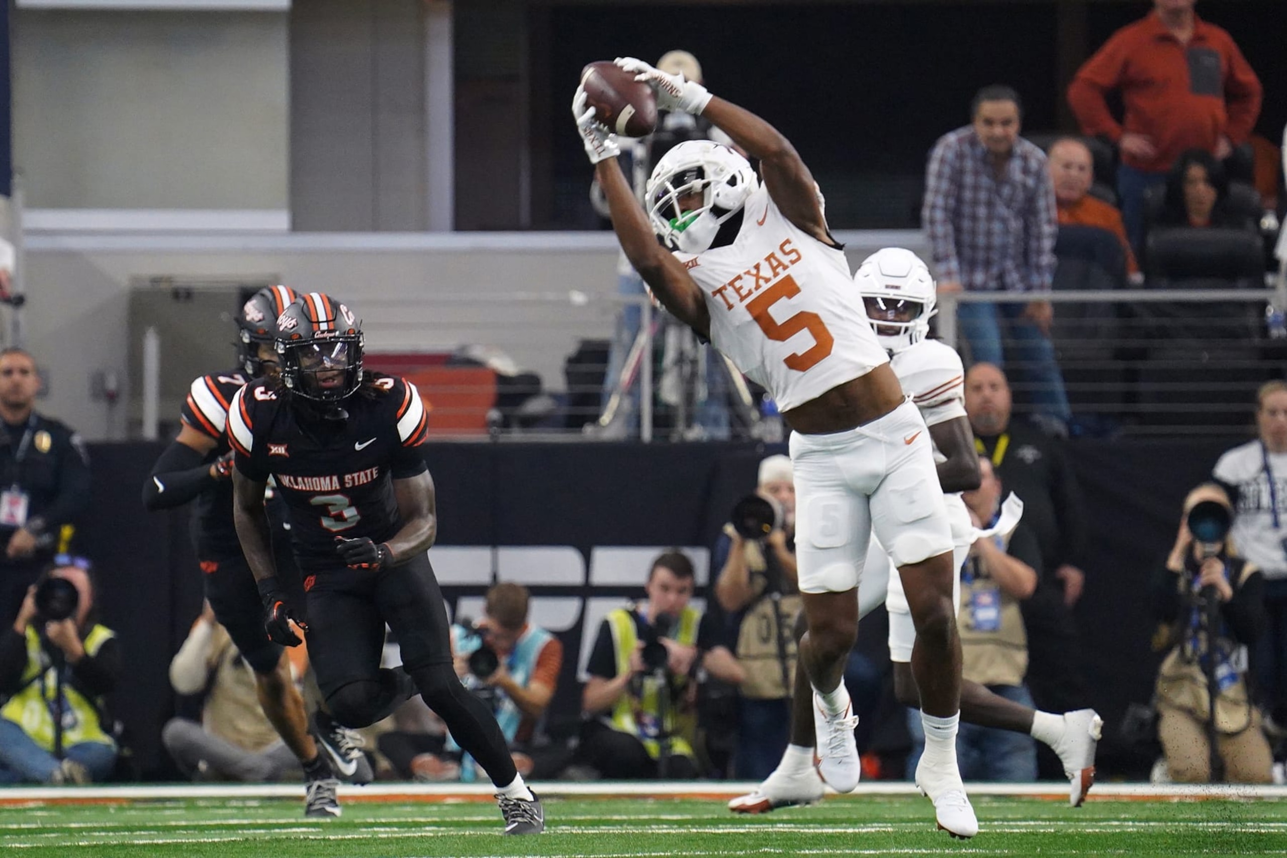 December 2, 2023, Arlington, Texas, United States: Texas Longhorns wide receiver Adonai Mitchell catches the ball during the 2023 Dr Pepper Big 12 Championship game between Texas Longhorns and Oklahoma State Cowboys. (Photo by Javier Vicencio / Eyepix Group) (Photo credit should read Javier Vicencio / Eyepix Group/Future Publishing via Getty Images)