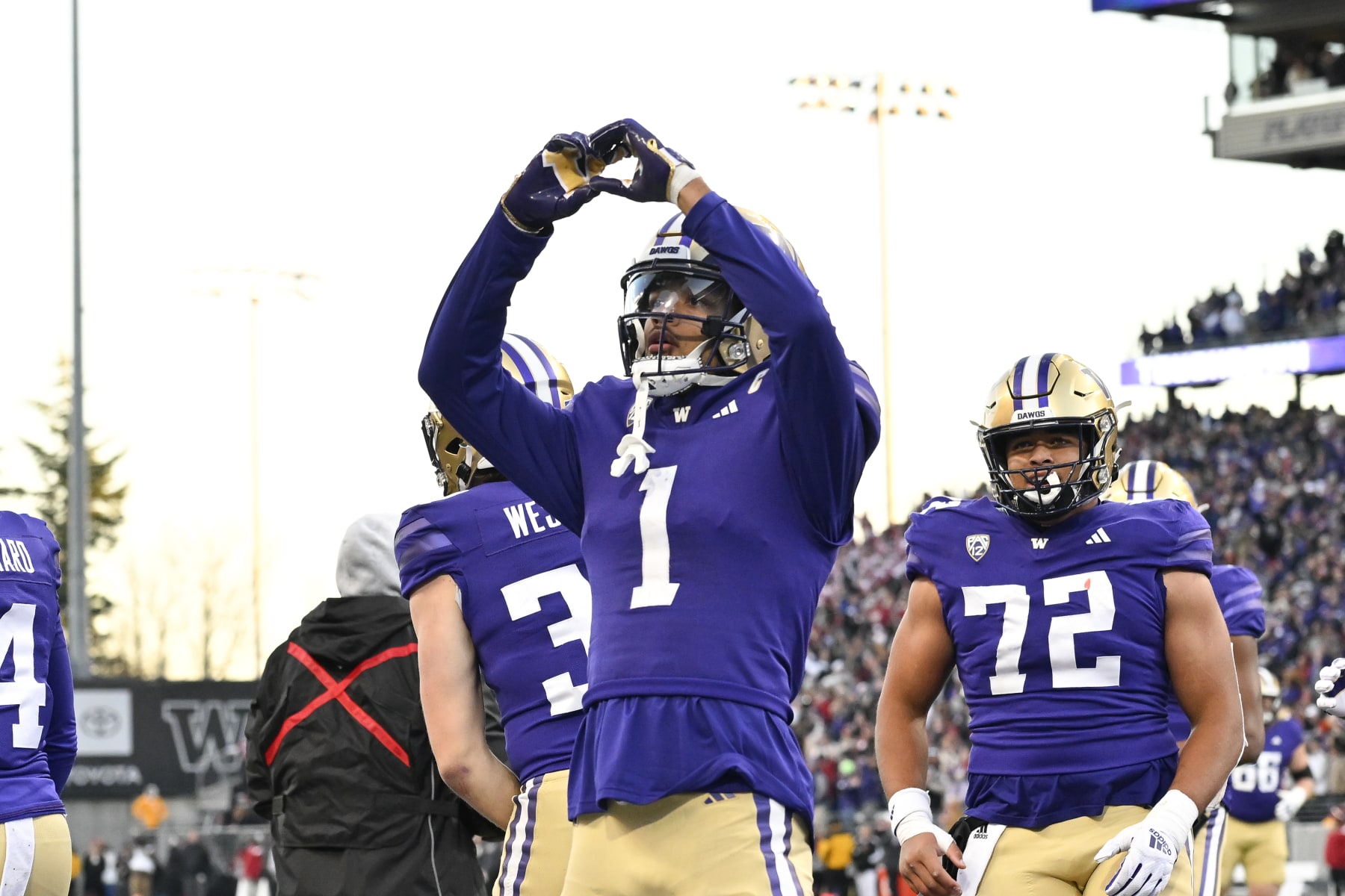 SEATTLE, WASHINGTON - NOVEMBER 25: Rome Odunze #1 of the Washington Huskies reacts after scoring a touchdown againstthe Washington State Cougars during the third quarter at Husky Stadium on November 25, 2023 in Seattle, Washington. The Washington Huskies won 24-21. (Photo by Alika Jenner/Getty Images)